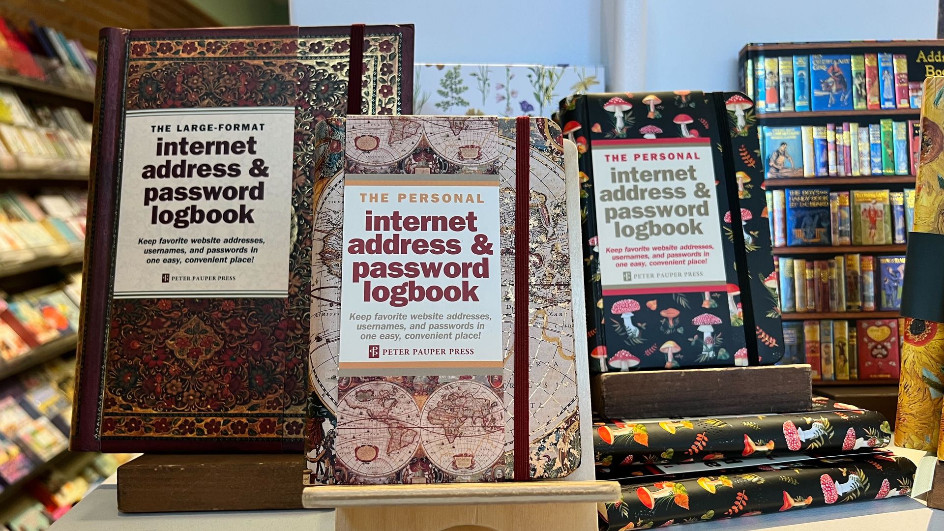 An image of three books on display at a bookstore that read "Internet Address & Password Logbook"
