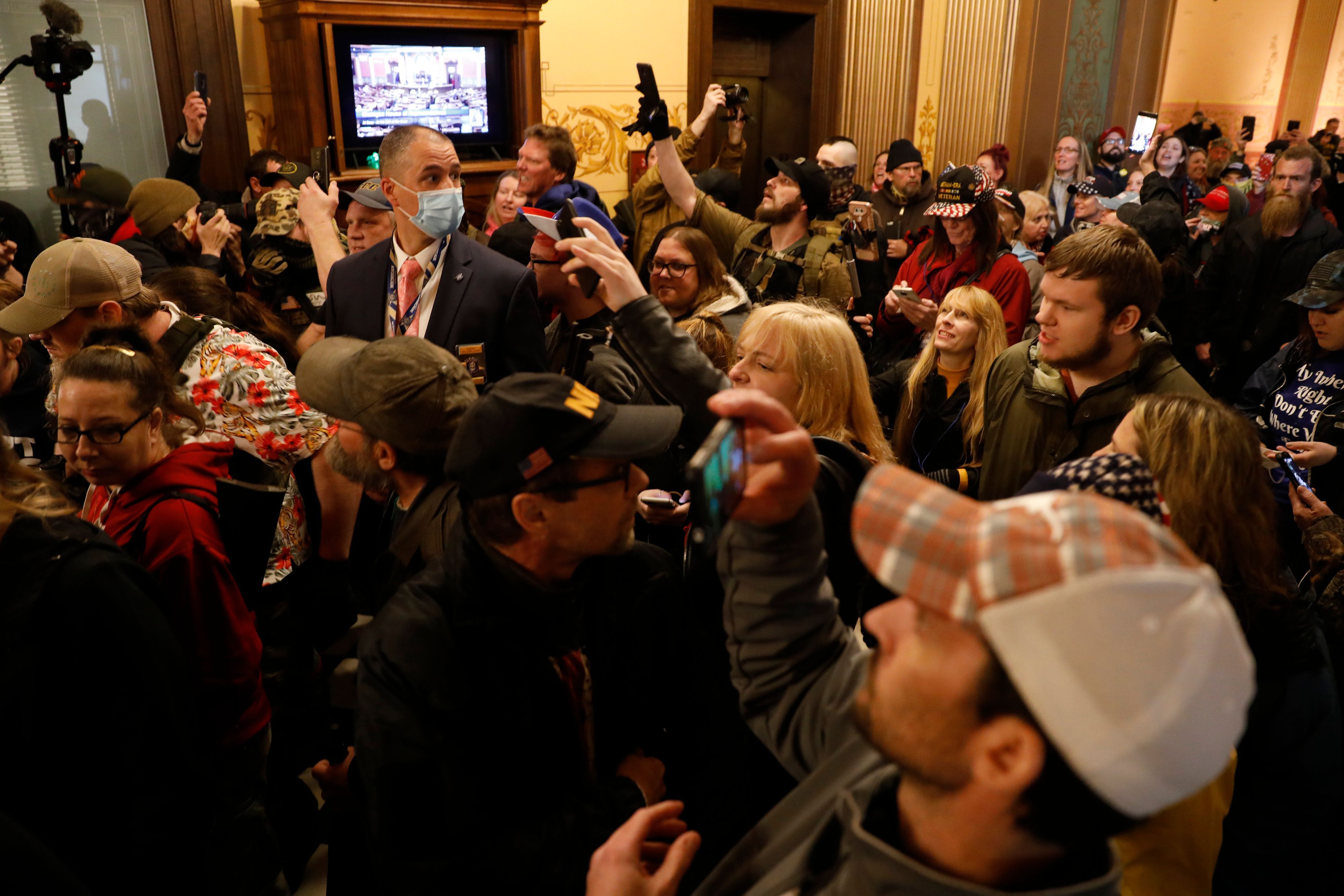 Protestors try to enter the Michigan House of Representative chamber