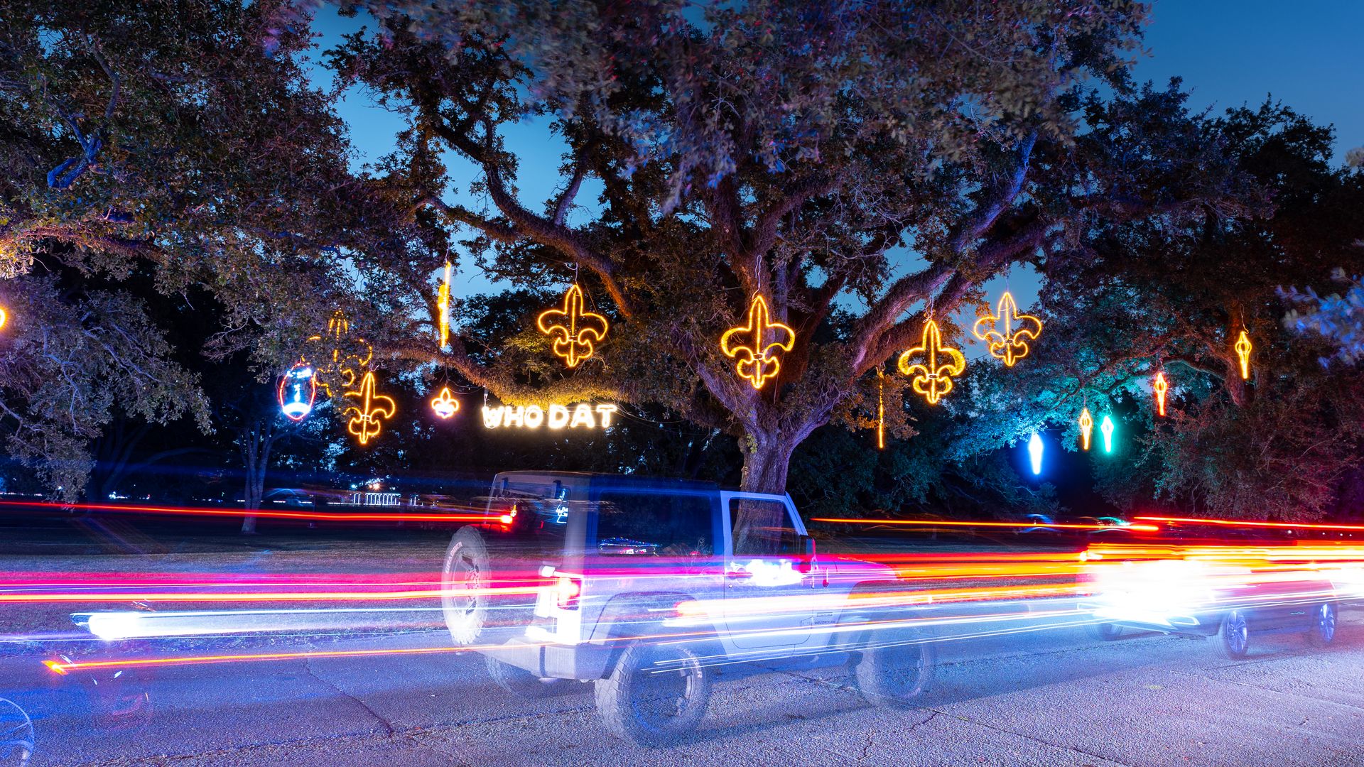 Photo shows cars driving through Celebration in the Oaks in New Orleans