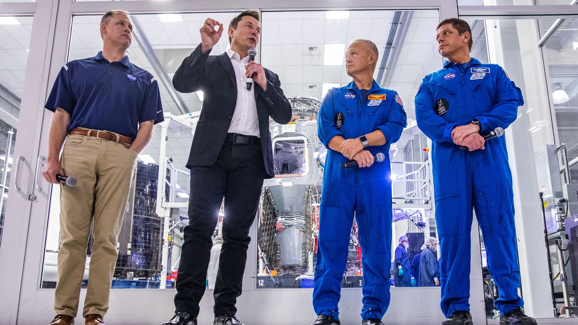 Elon Musk talks with a microphone.