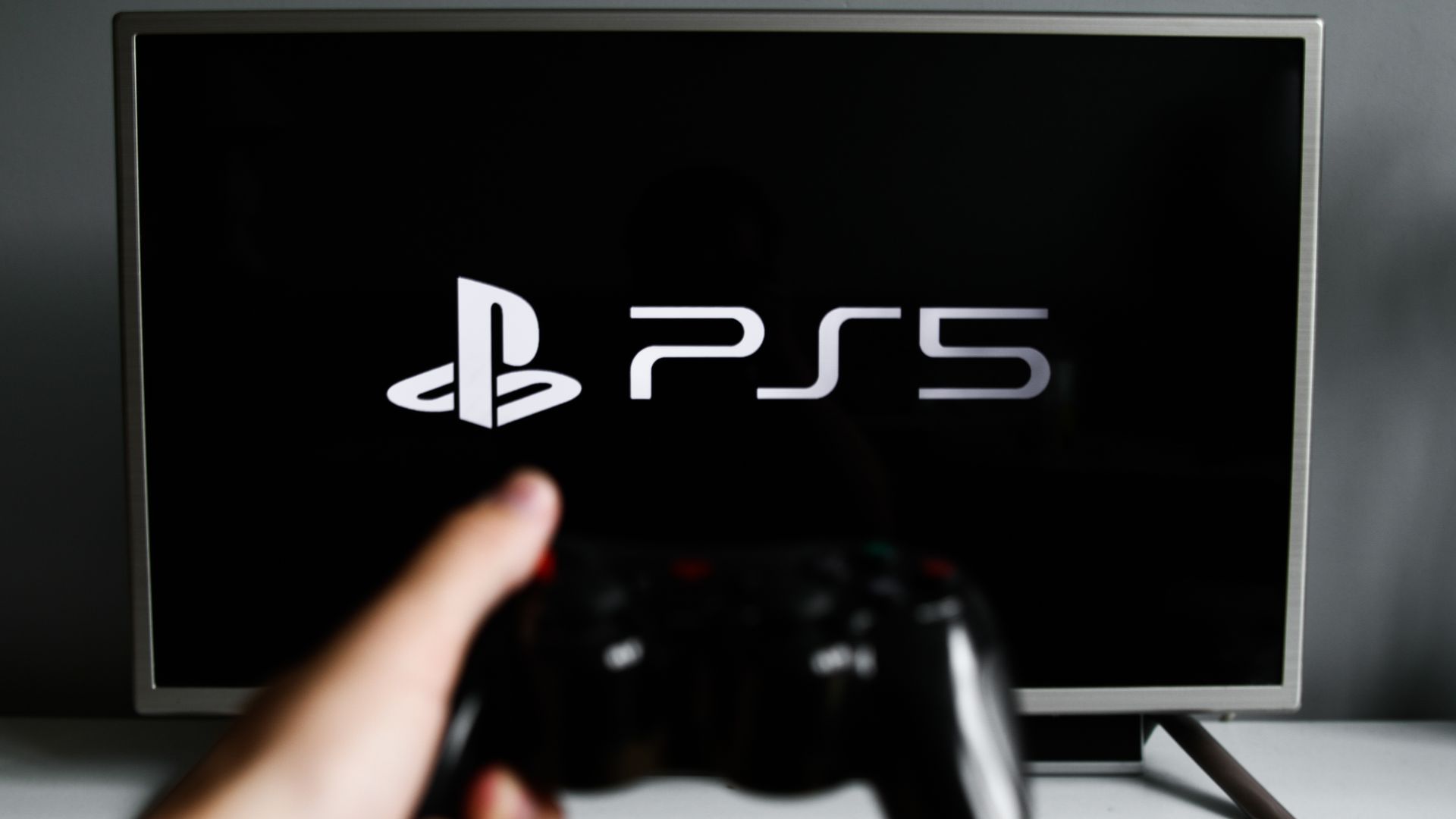 Sony PlayStation 5 image on screen with controller