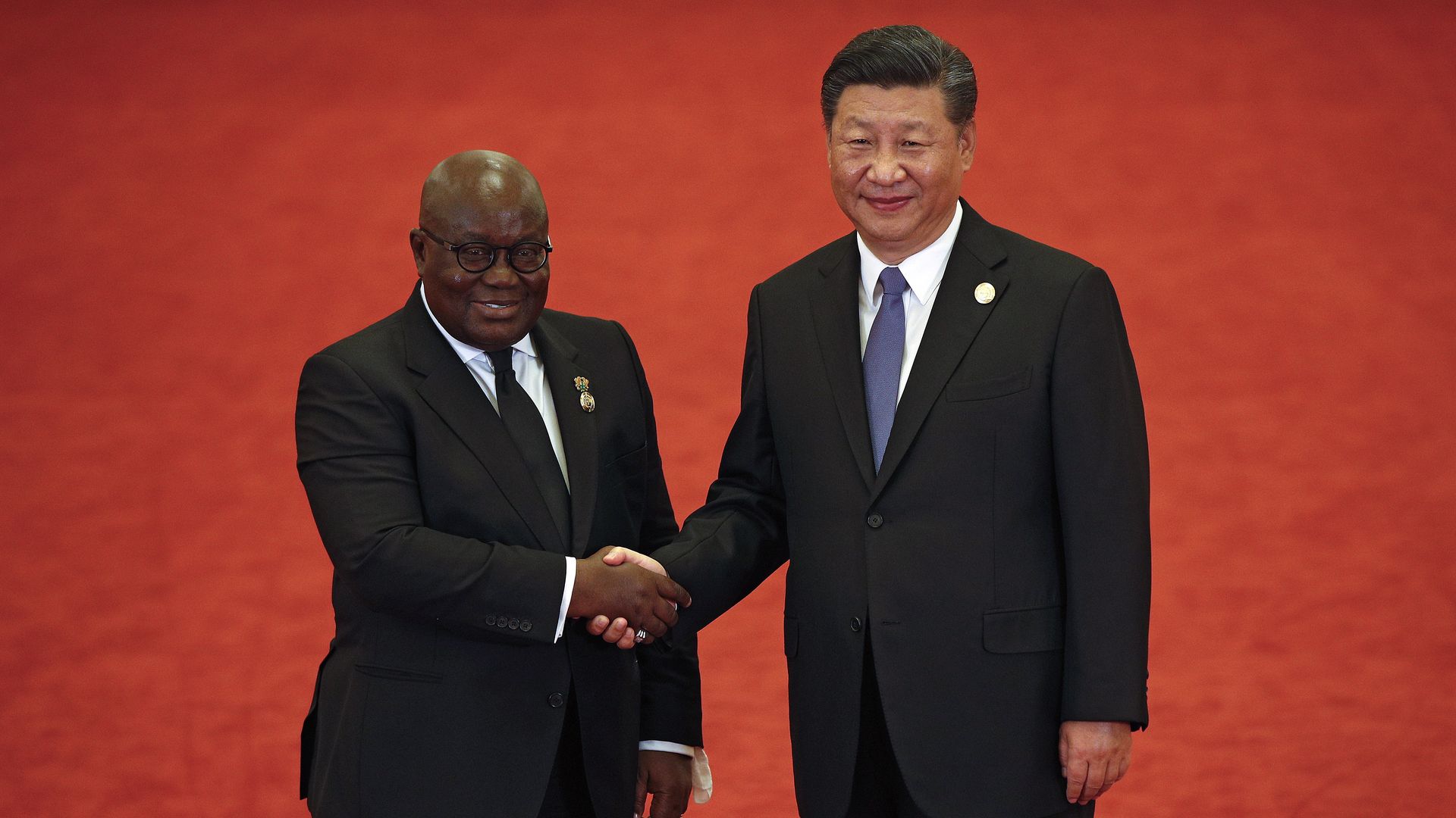 Ghana's President Nana Akufo-Addo, left, shakes hands with Chinese President Xi Jinping in Beijing on September 3, 2018