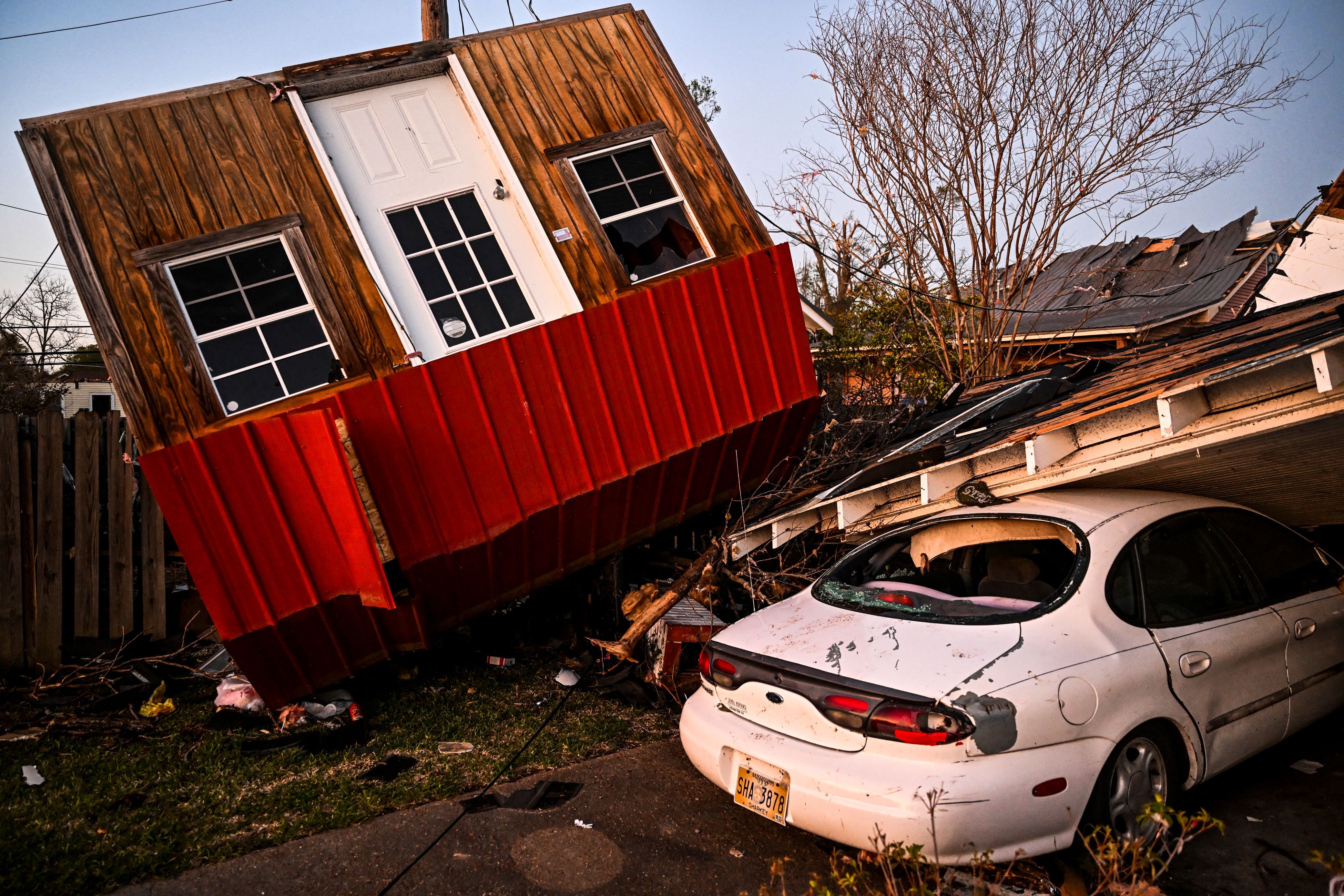 The remains of crushed house and cars are seen in Rolling Fork, Mississippi after a tornado touched down in the area.