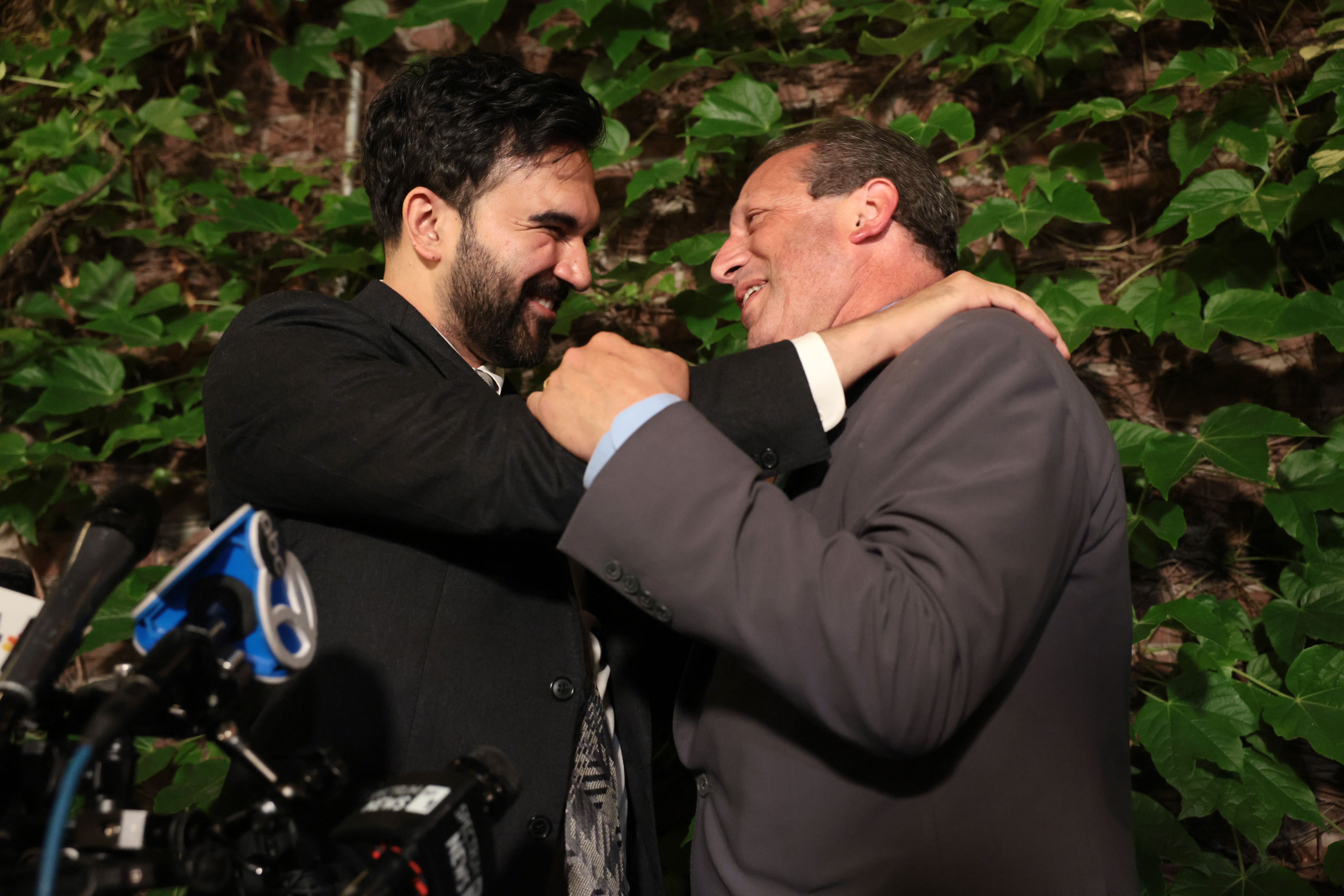 New York Mayor Zohran Mamdani and former NYC comptroller Brad Lander embrace last night at a victory party in Brooklyn. Photo: Spencer Platt/Getty Images