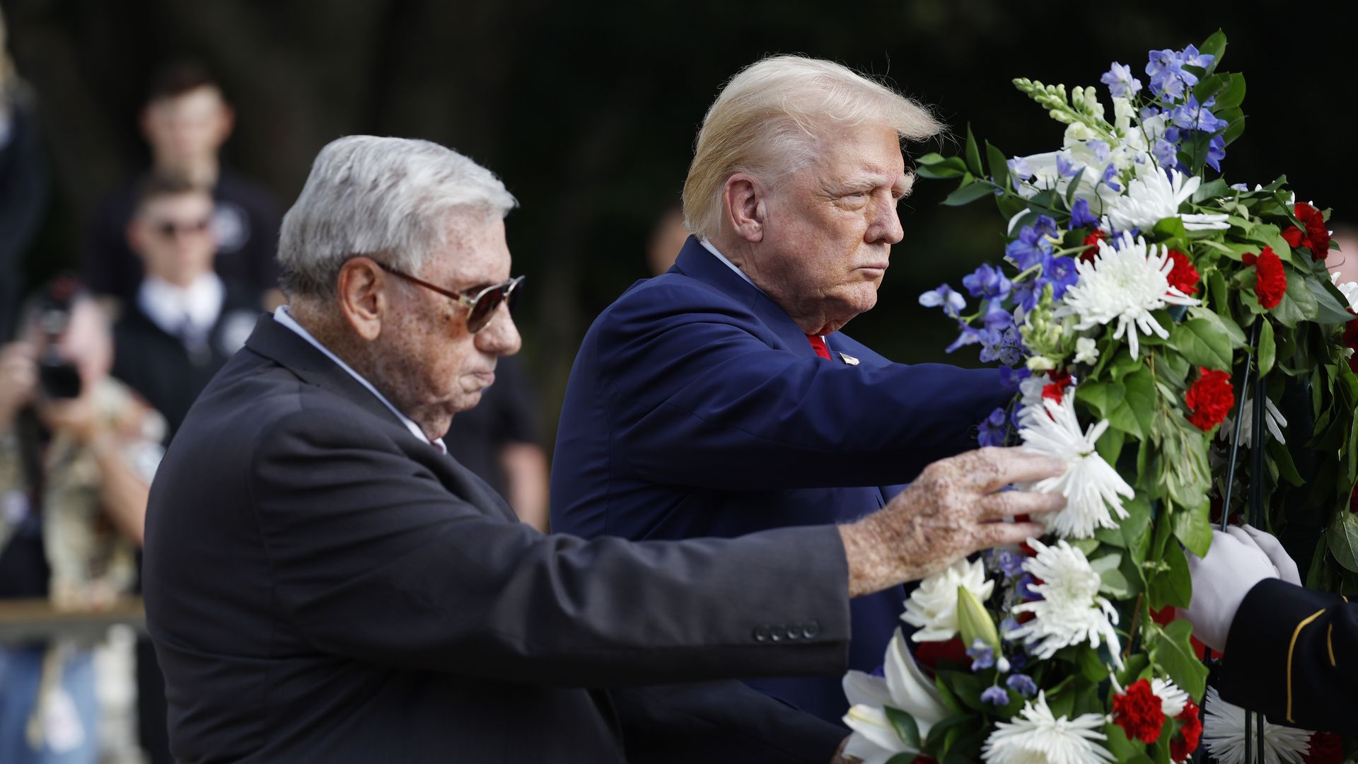 Former President Trump attends a wreath-laying ceremony beside a man whose grandson died in the Abbey Gate Bombing.