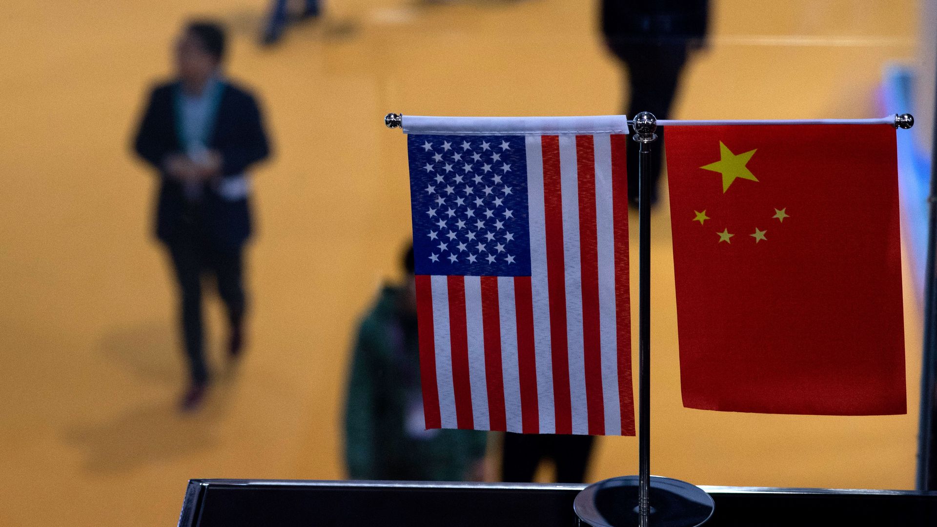 A Chinese and US flag at a booth during the first China International Import Expo (CIIE) in Shanghai.