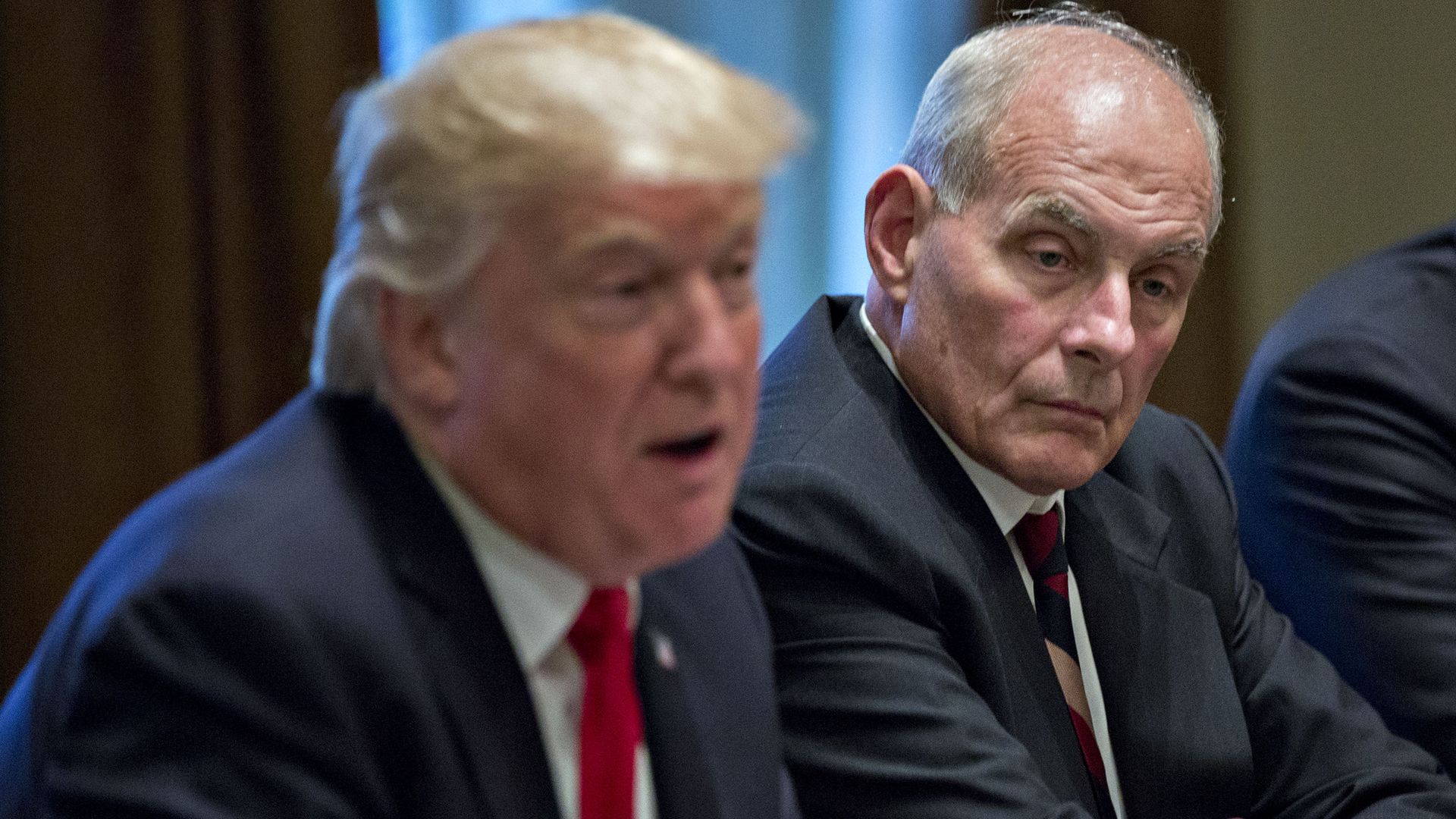 John Kelly looks on while President Trump speaks