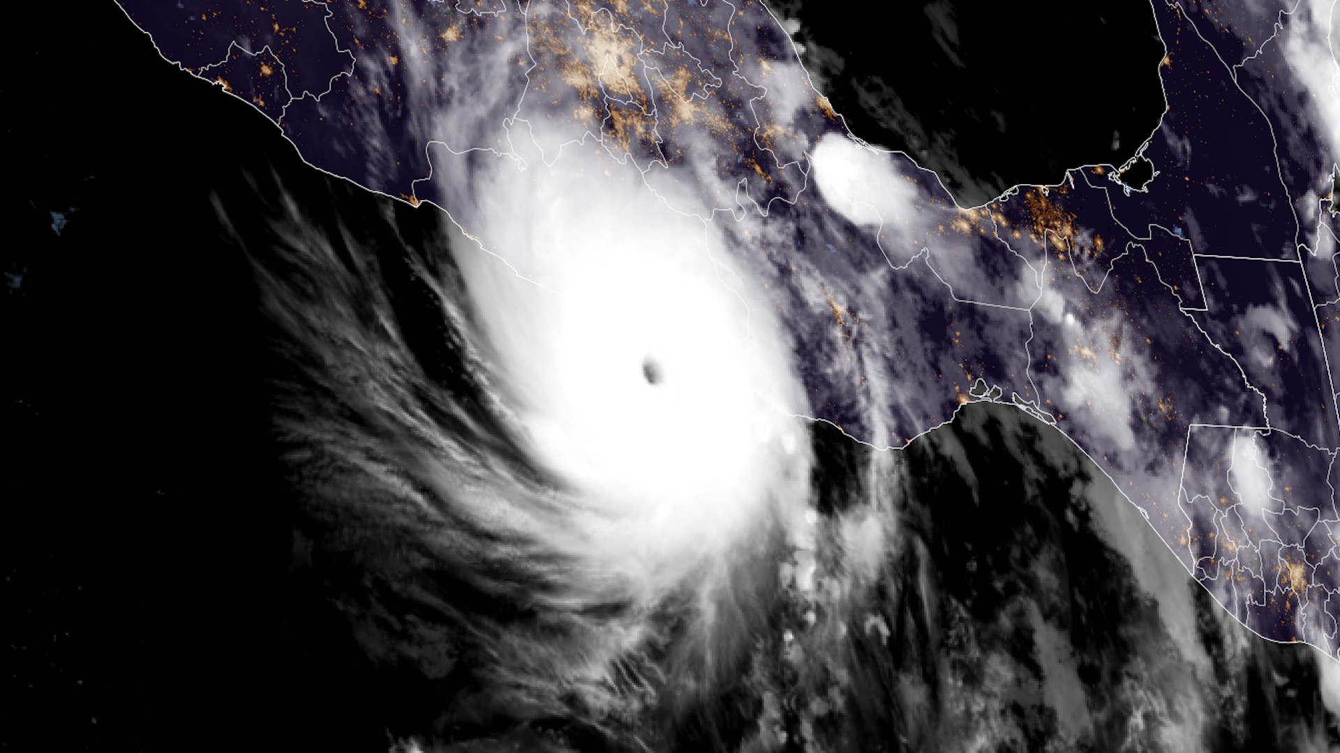 Nighttime satellite image of a Category 5 hurricane making landfall along the Mexican coast.