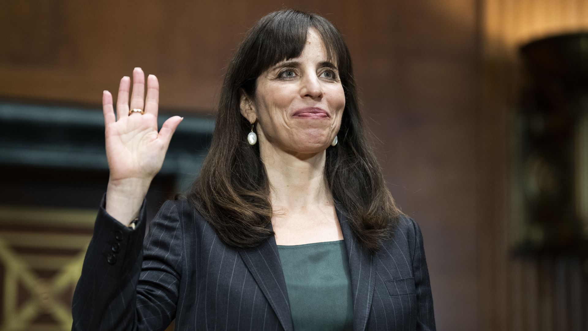 A judicial nominee is seen beaming before her confirmation hearing.