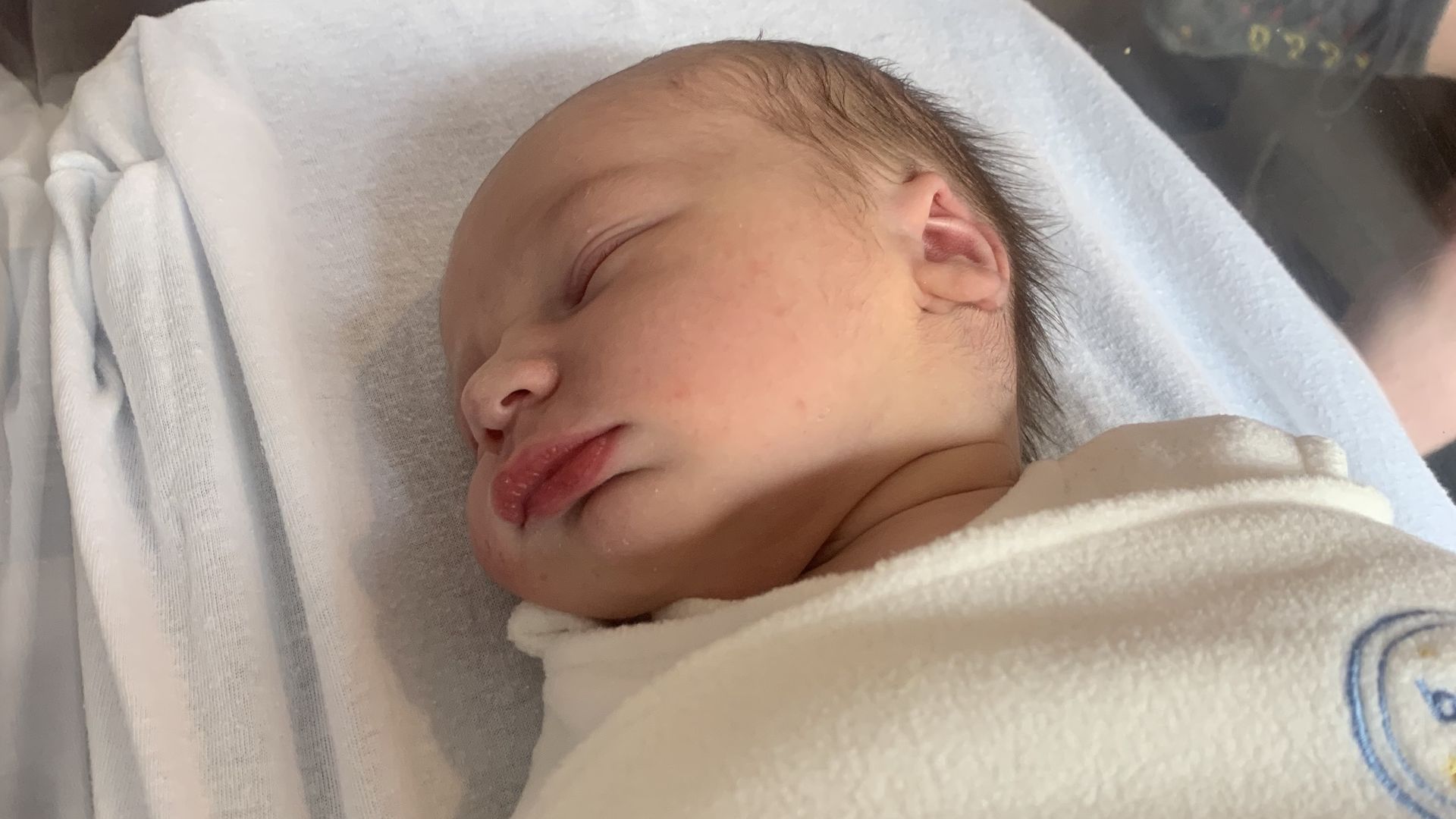 Torey's baby Jack lays in his hospital bassinet 