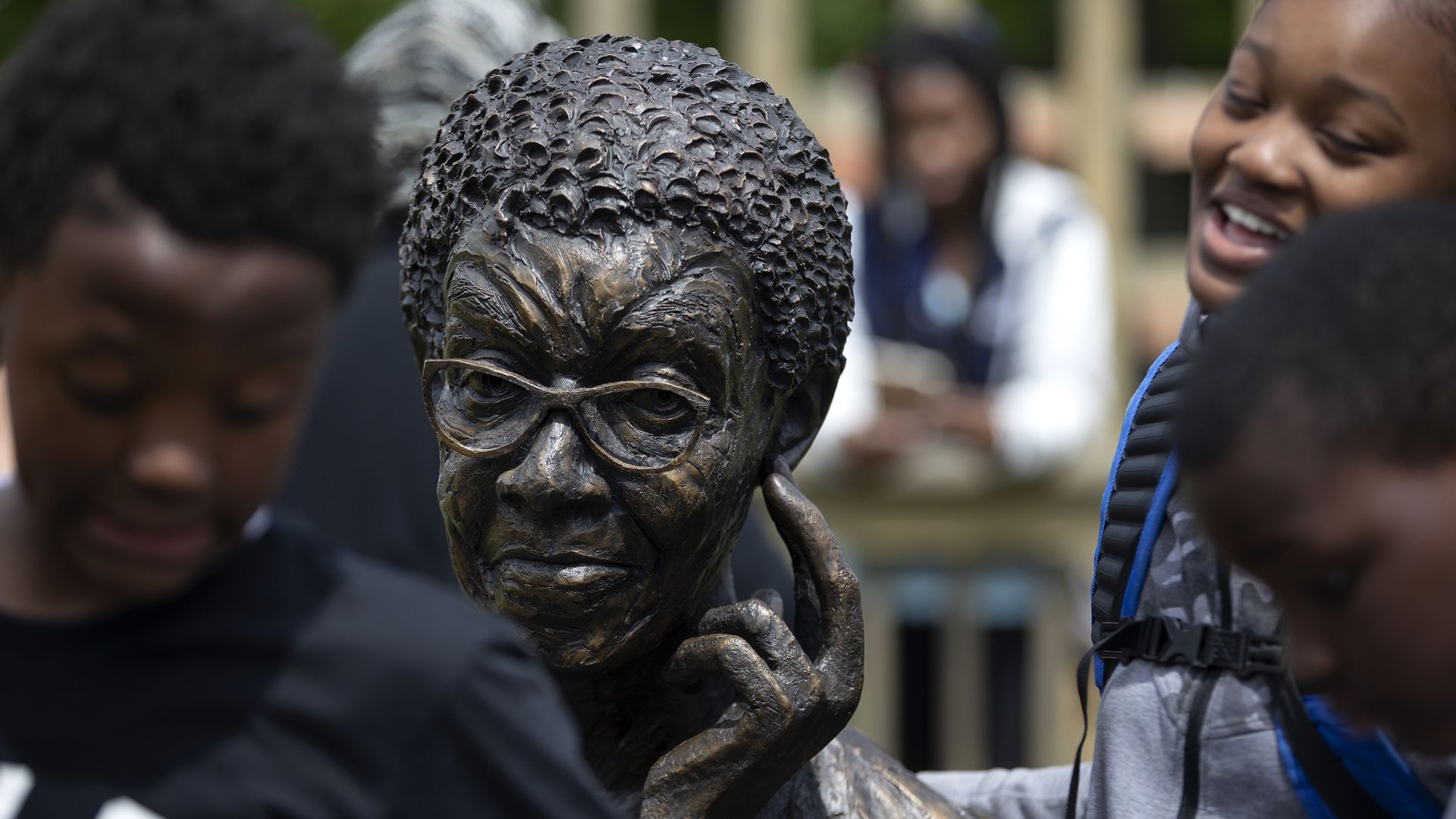 Photo of a statue of a woman wearing glasses