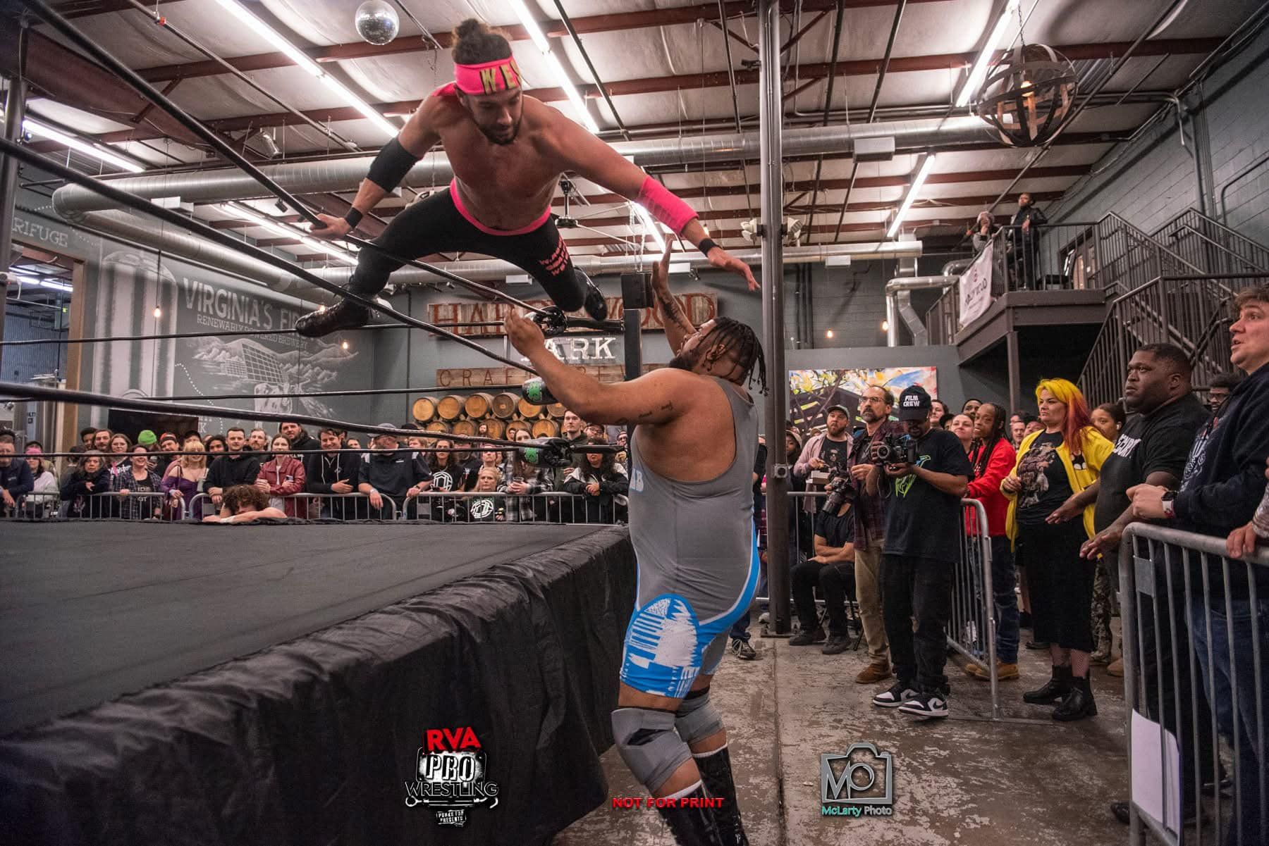 two men jumping on each other 