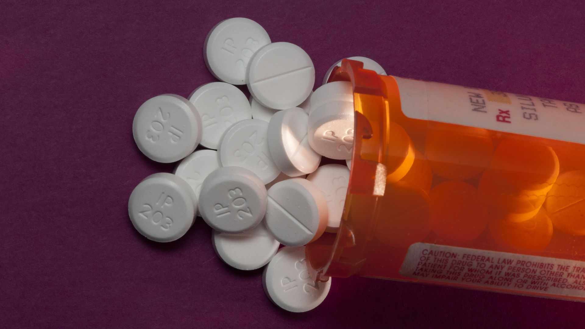 A bottle of oxycodone pills on a table.