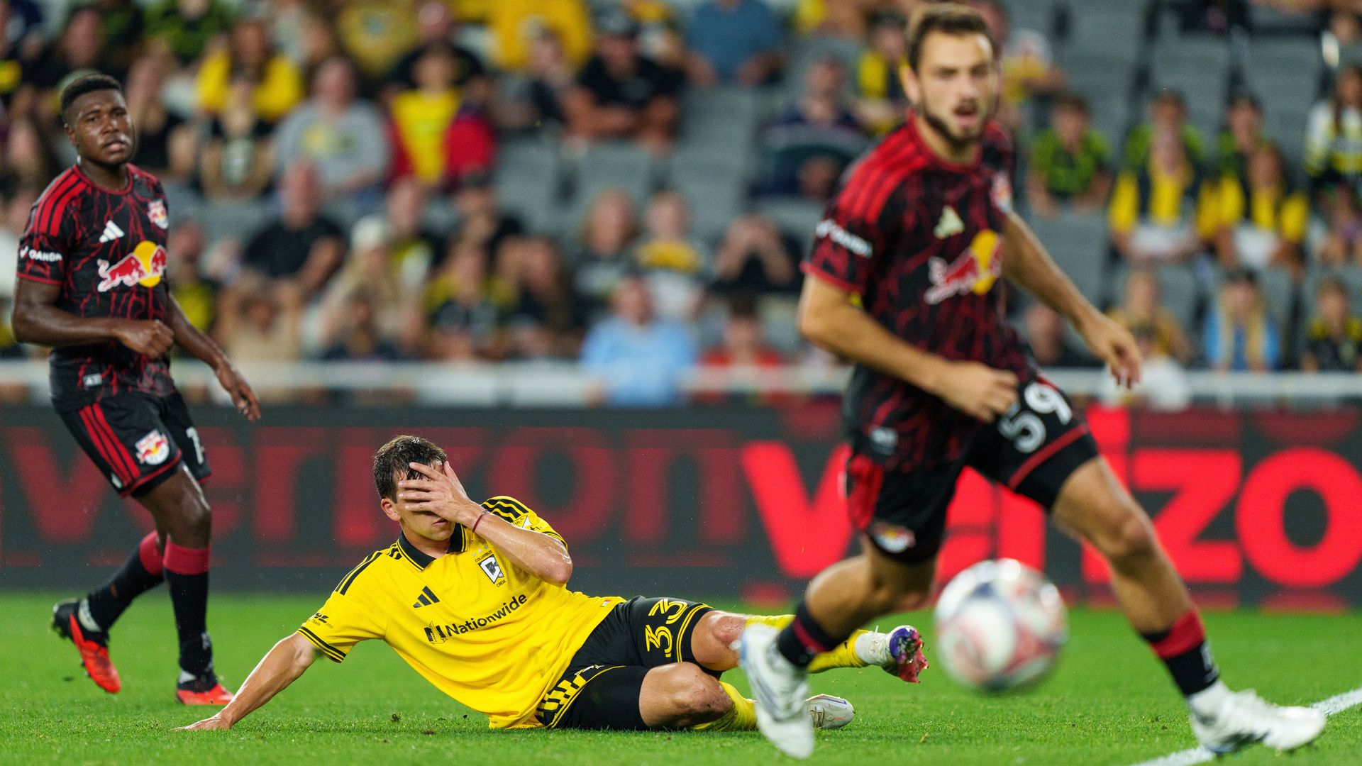 Crew forward Gonzalo Tapia hides his face after a miss against the New York Red Bulls.