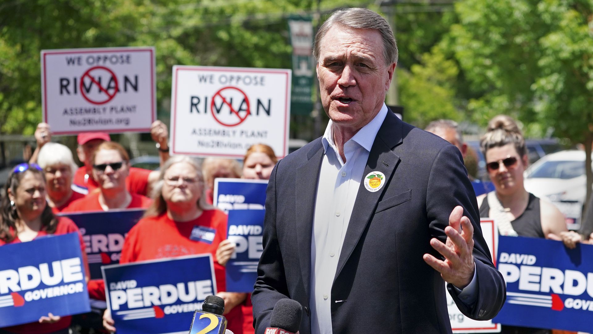 David Perdue at a Rivian opposition press conference