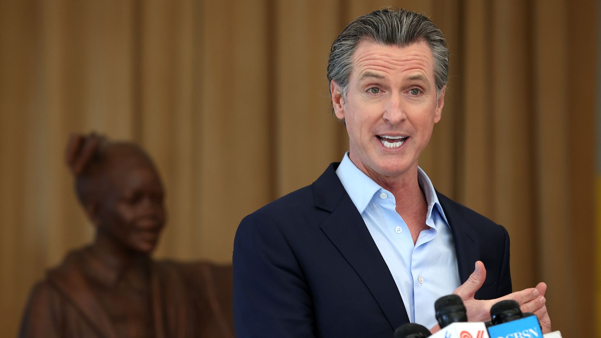 California Gov. Gavin Newsom speaks during a news conference after he toured the newly reopened Ruby Bridges Elementary School on March 16