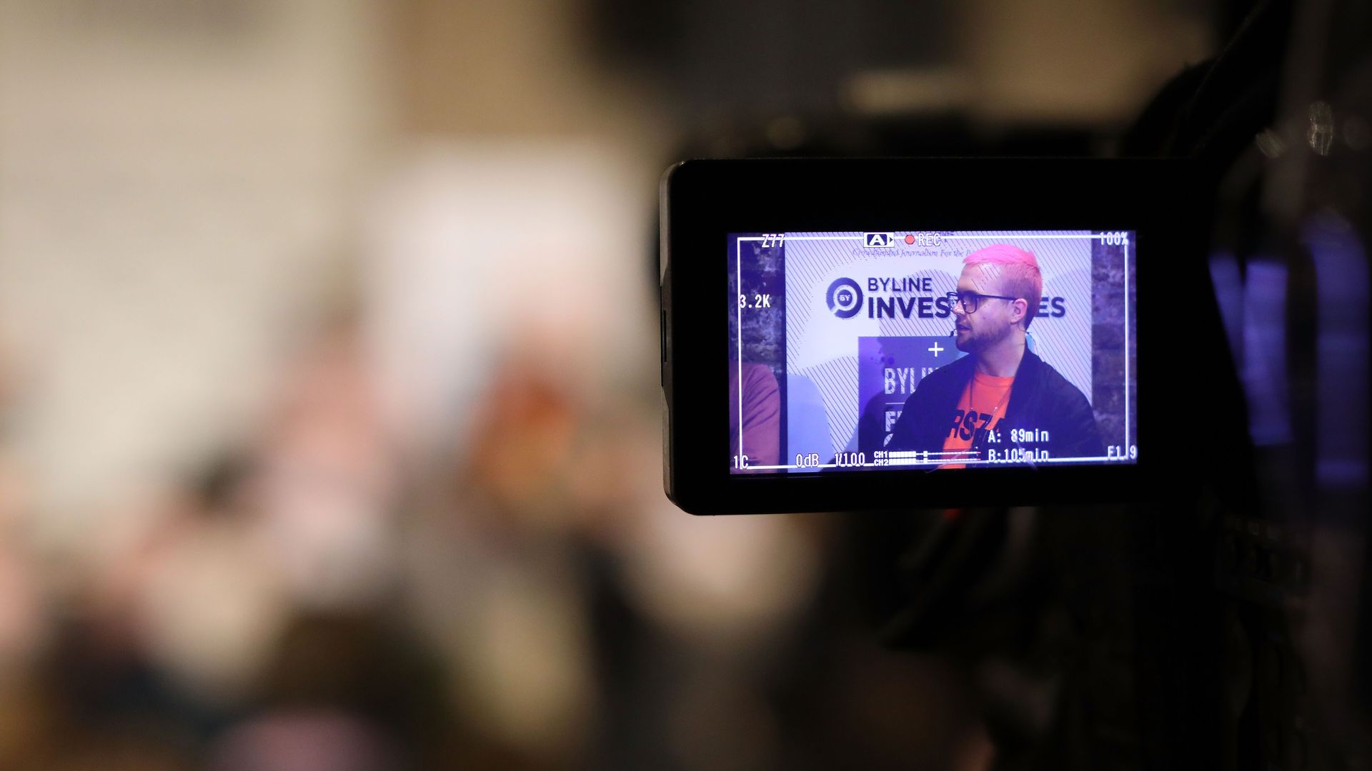 Christopher Wylie is shown on the screen of a video camera