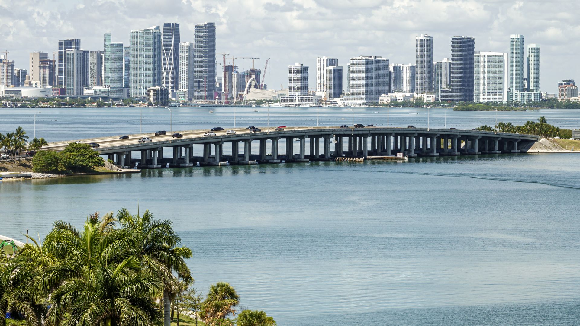 A highway, water and Miami skyline.