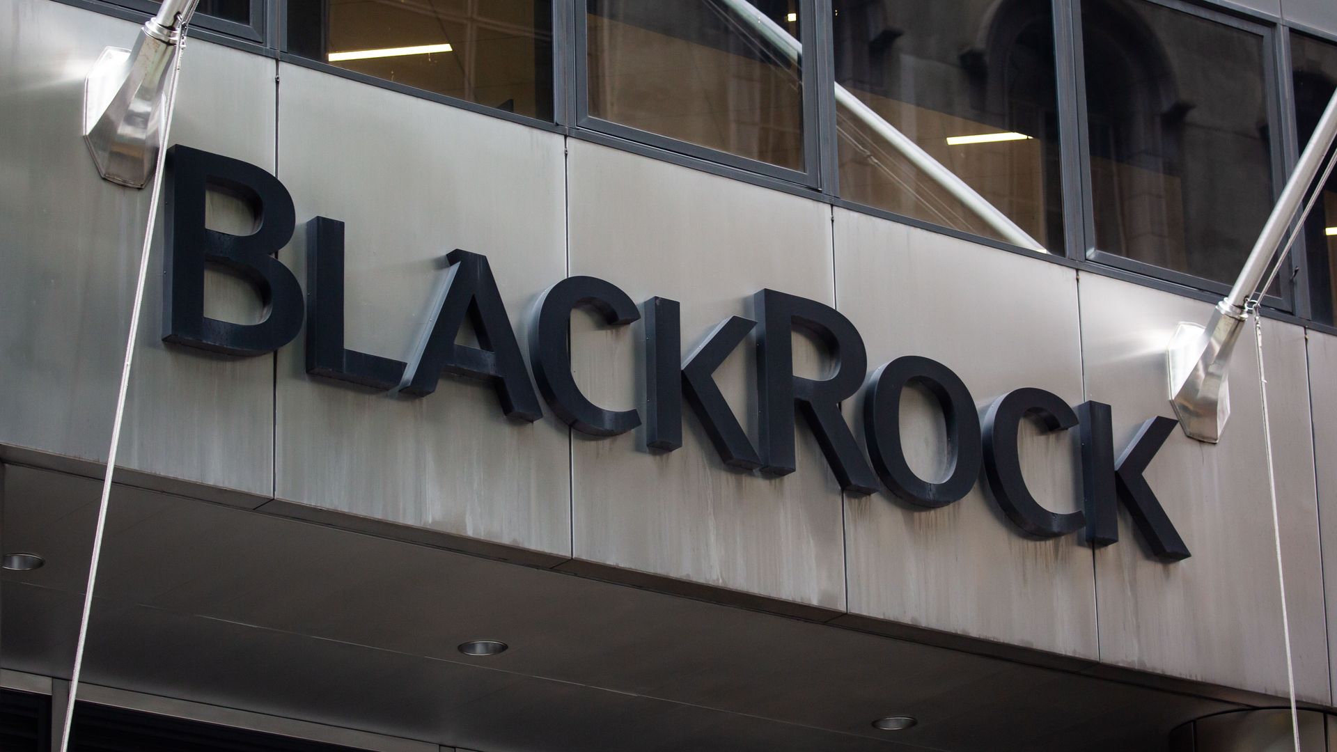 photo of a sign of the BlackRock logo on the outside of its office