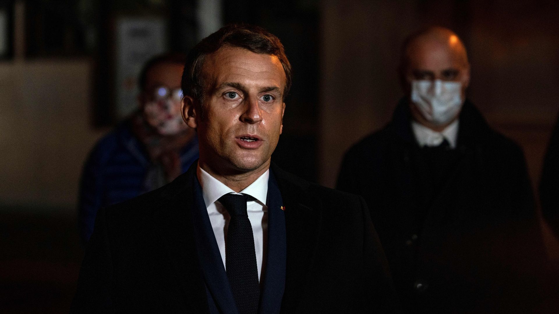 French President Emmanuel Macron speaking in front of a school on Oct. 16.