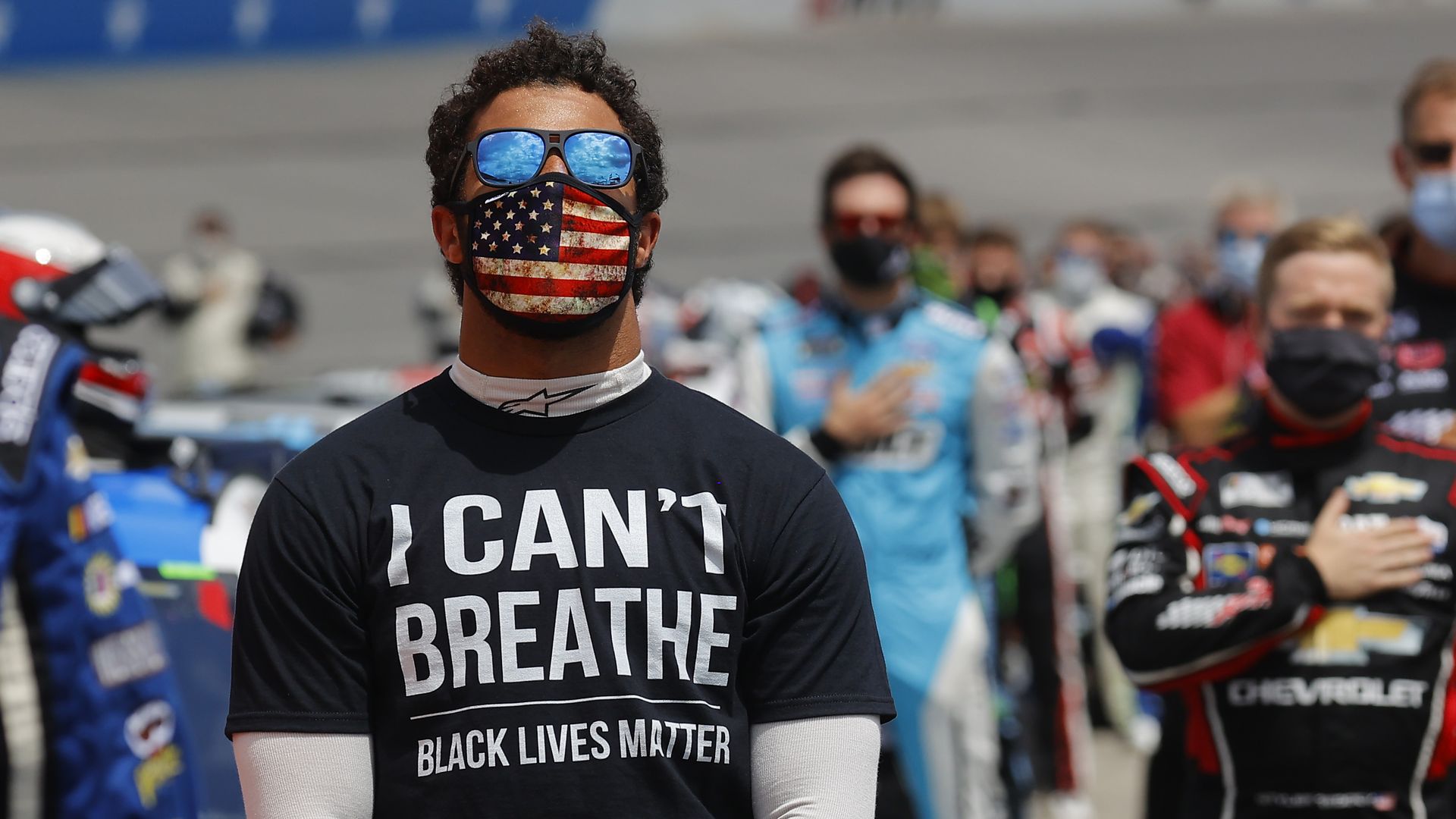 Bubba Wallace, driver of the #43 McDonald's Chevrolet, wears a "I Can't Breathe - Black Lives Matter" T-shirt