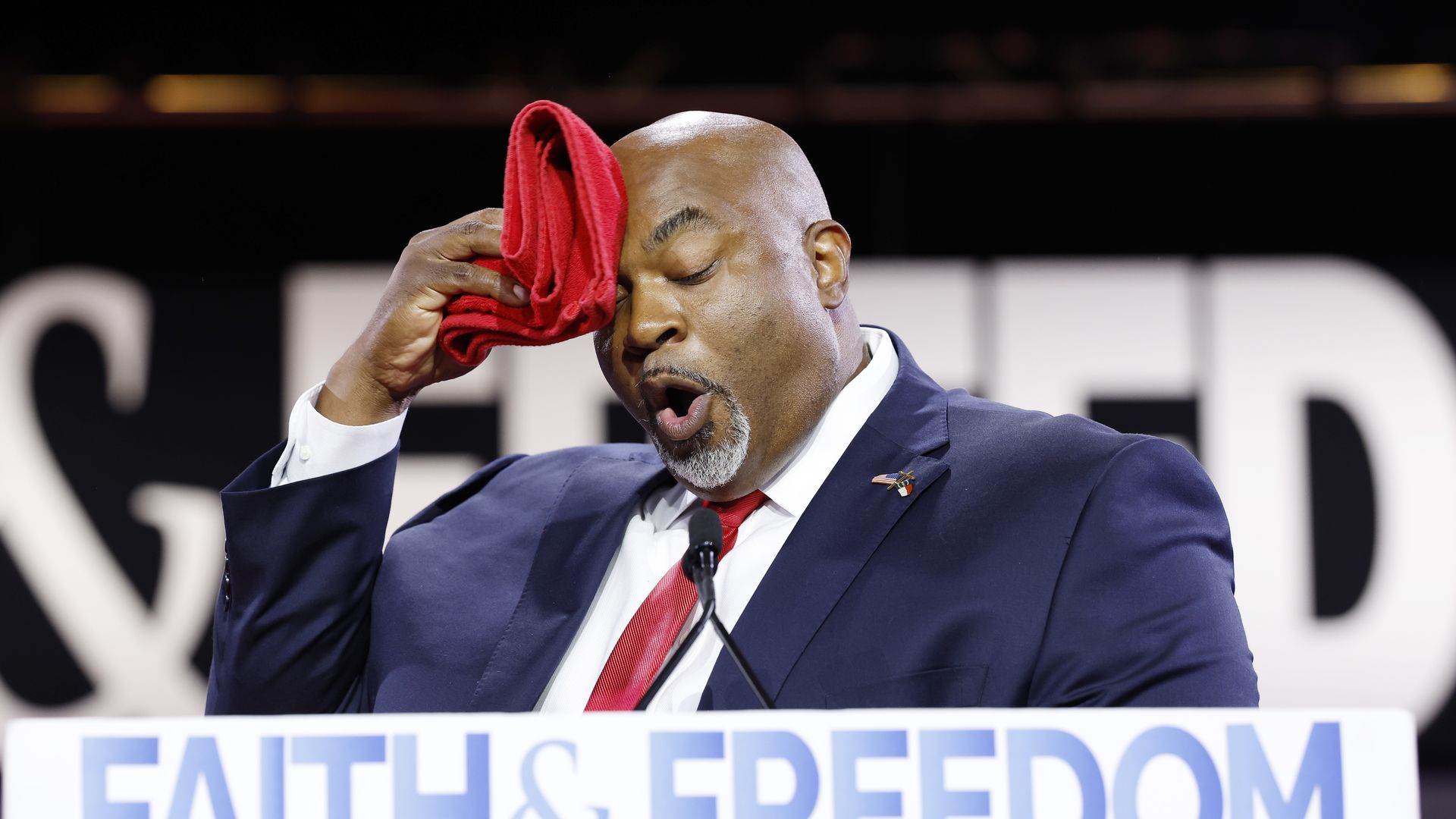 North Carolina Lieutenant Governor Mark Robinson wipes his brow as he speaks at the Faith and Freedom Road to Majority conference.