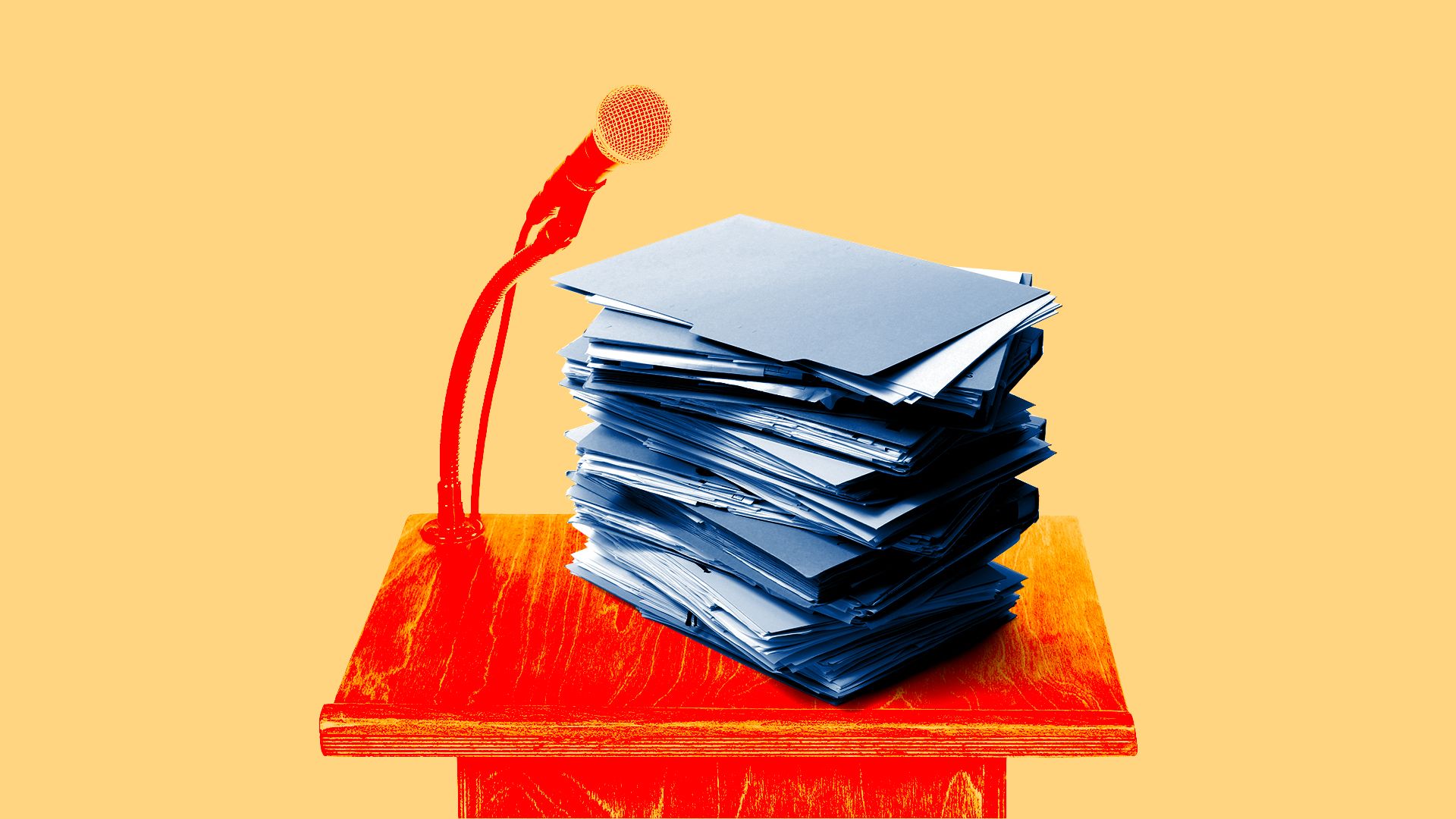 stack of file folders on a lectern with a microphone