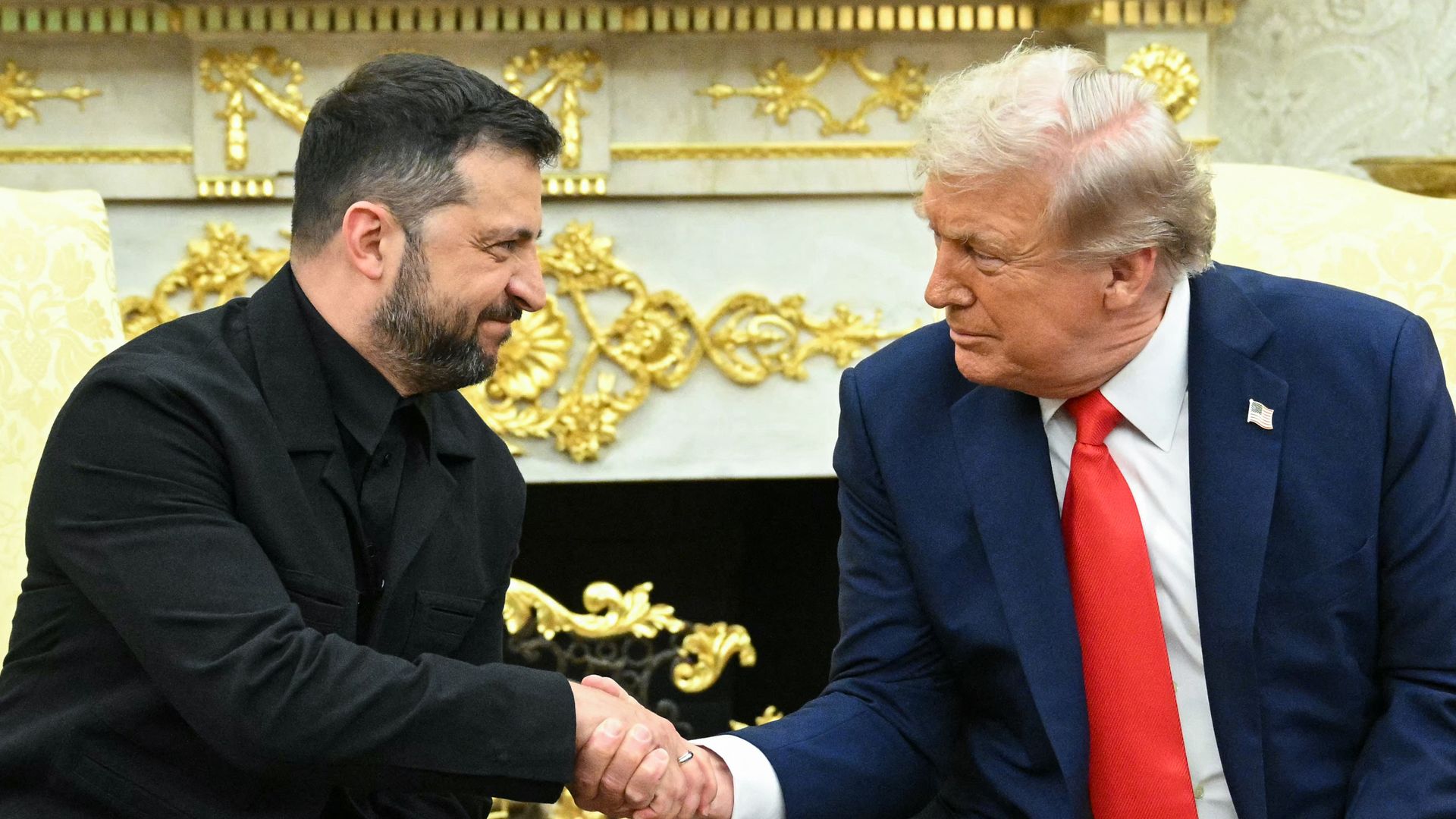 Ukrainian President Volodymyr Zelensky and US President Donald Trump shake hands during a meeting in the Oval Office of the White House in Washington, DC, on August 18, 2025. European leaders join Ukrainian President Volodymyr Zelensky in talks with US President Donald Trump on August 18.