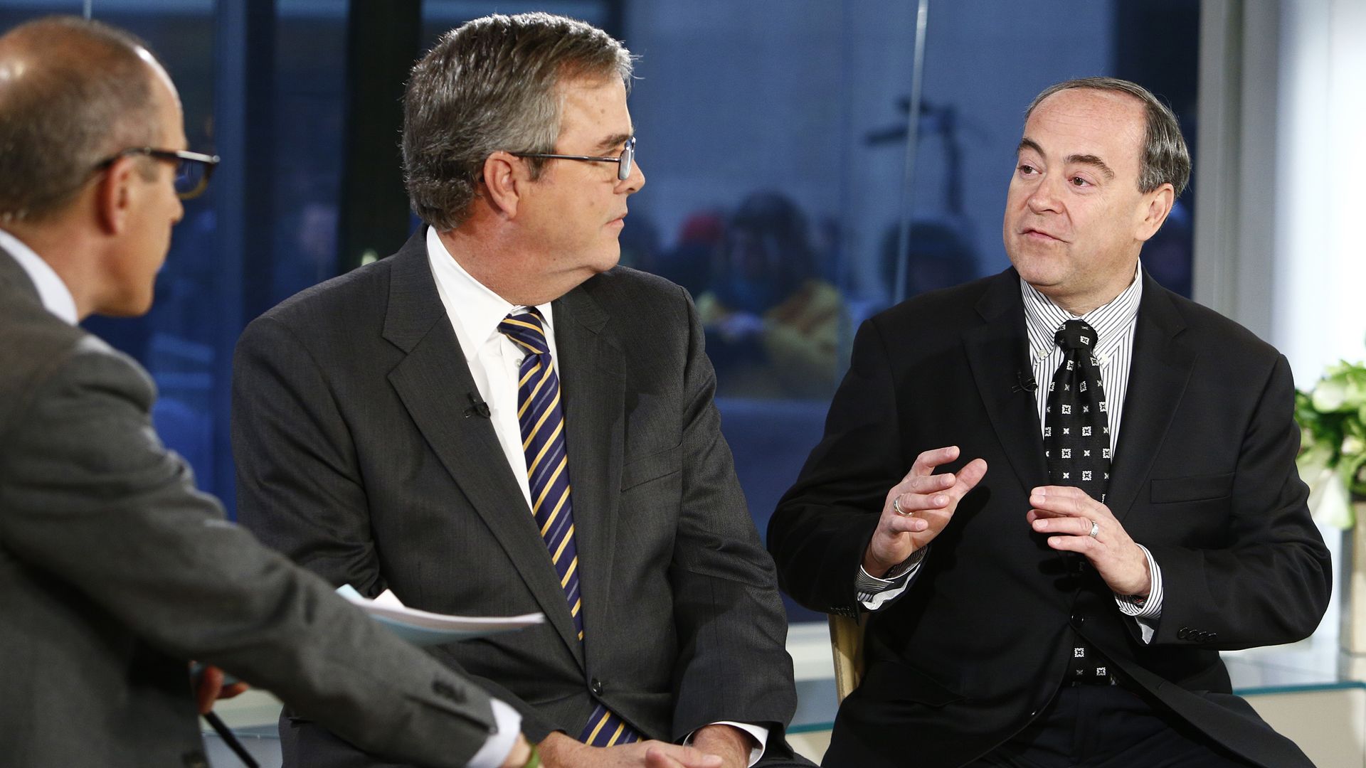 Two men sitting for an interview.