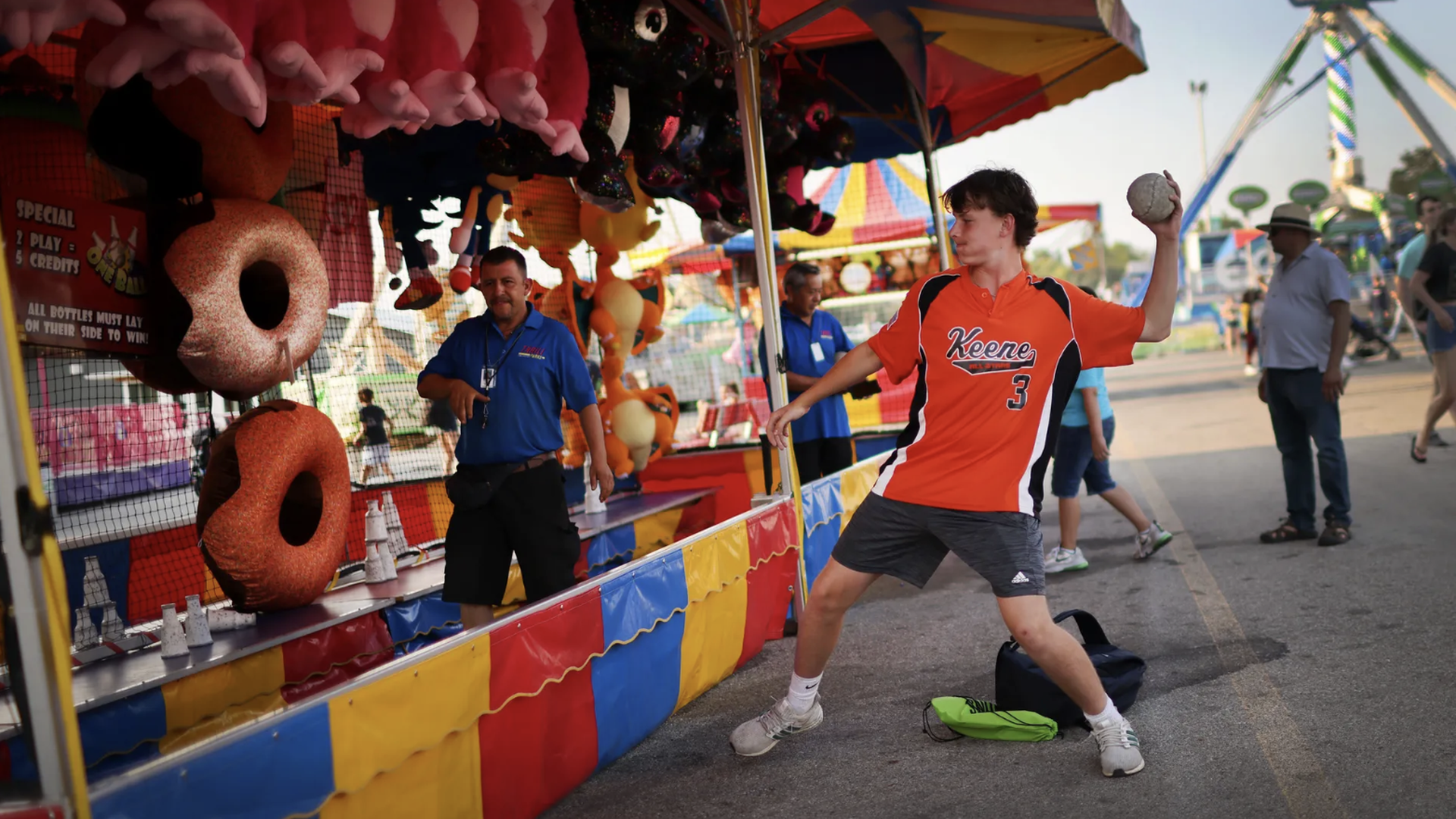 kid throwing ball at iowa state fair