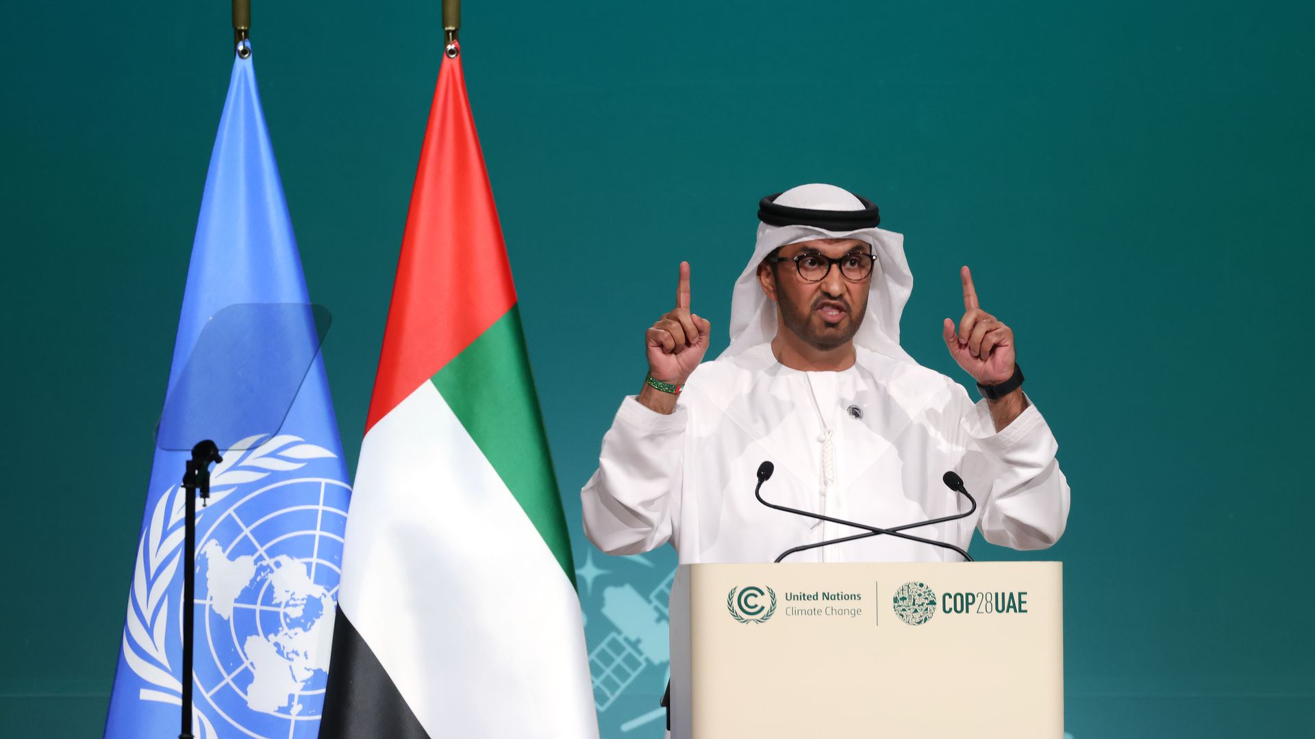 COP28 chairman Sultan Ahmed al-Jaber speaks at a podium at a UN climate summit.