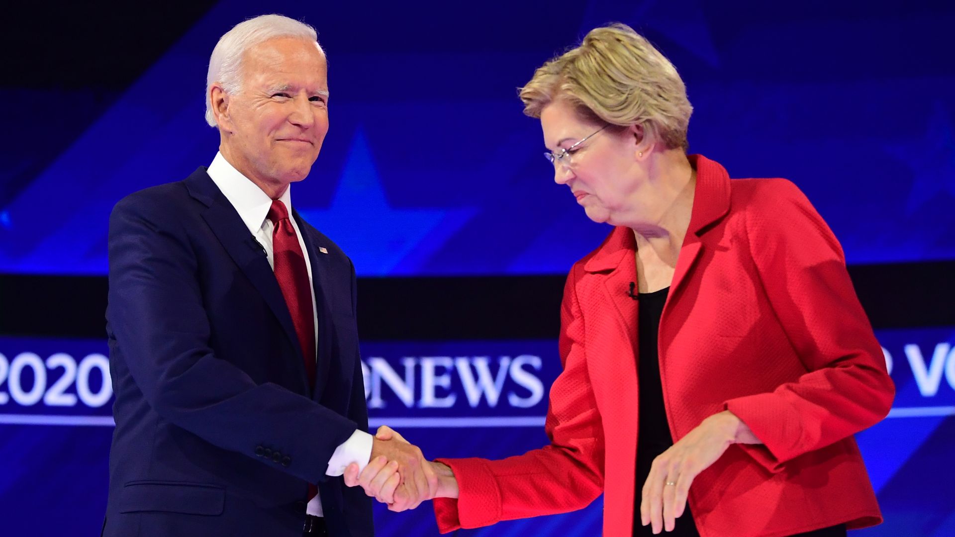 Warren and Biden shaking hands. 