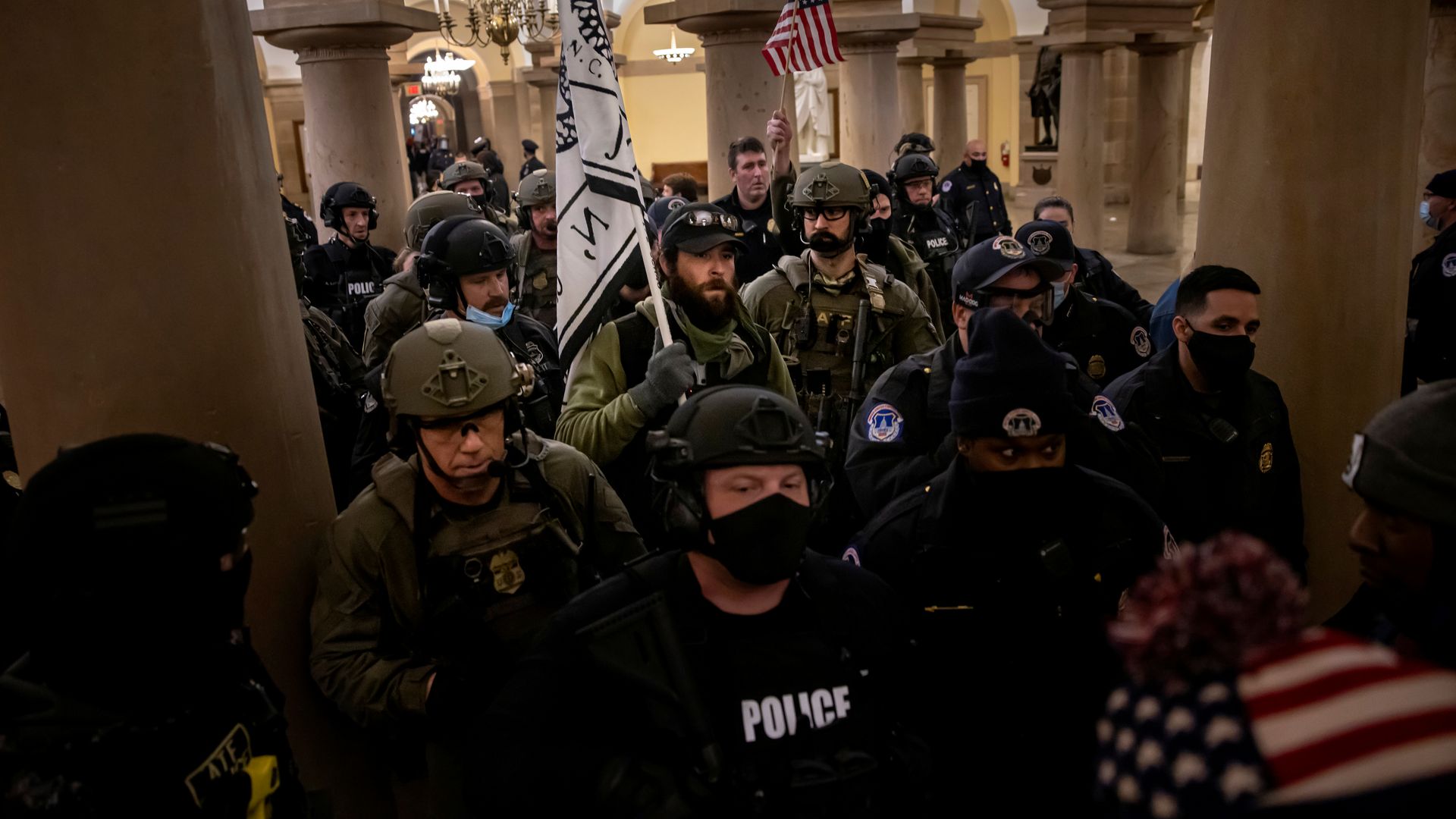 FBI and ATF law enforcement push out supporters of US President Donald Trump as they protested inside the US Capitol on January 6, 2021,