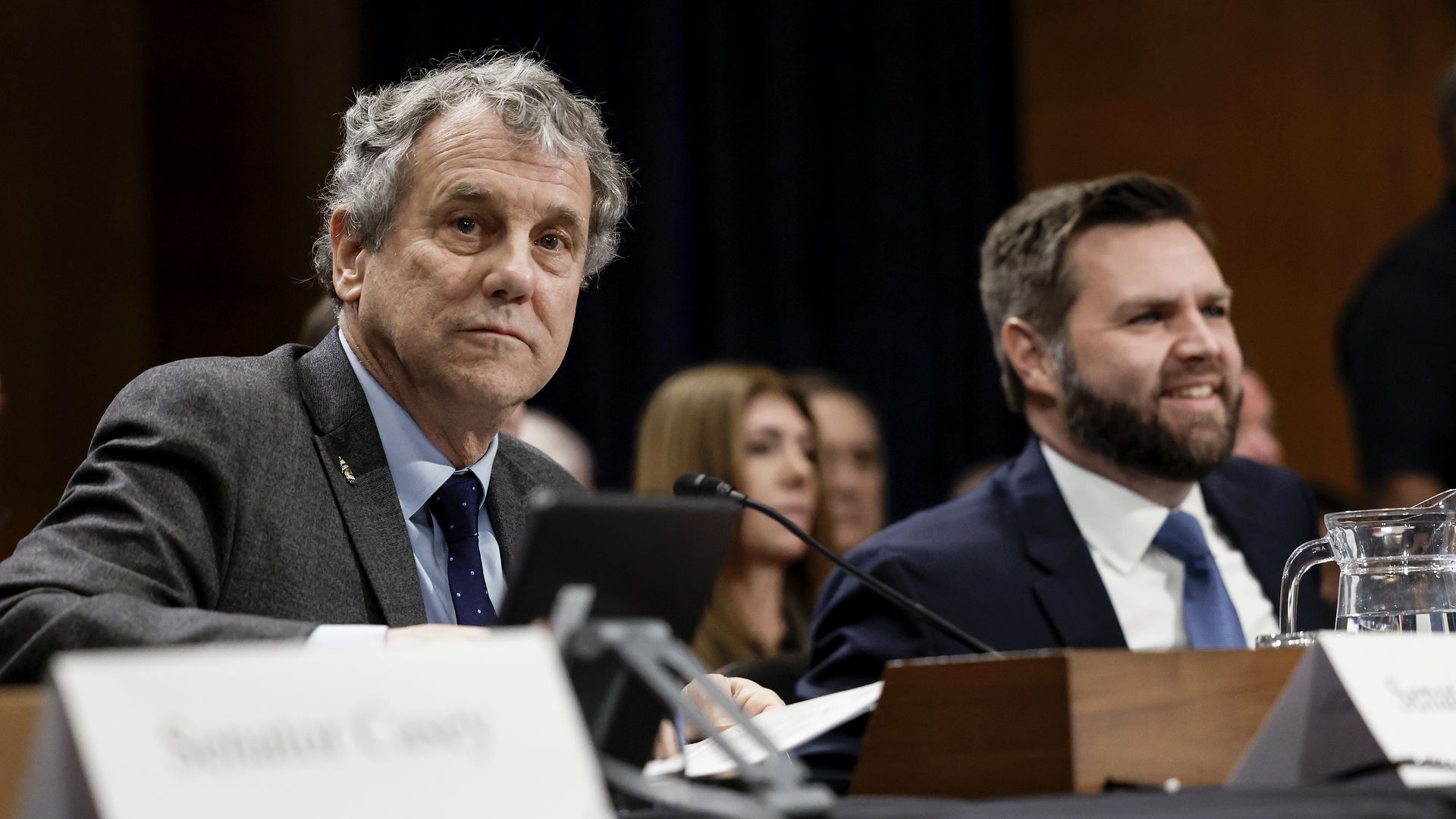 Sen. Sherrod Brown (D-OH) and Sen. JD Vance (R-OH) speak with one another before partaking in a panel with the Senate Environment and Public Works Committee on Capitol Hill on March 09, 2023 in Washington, DC.