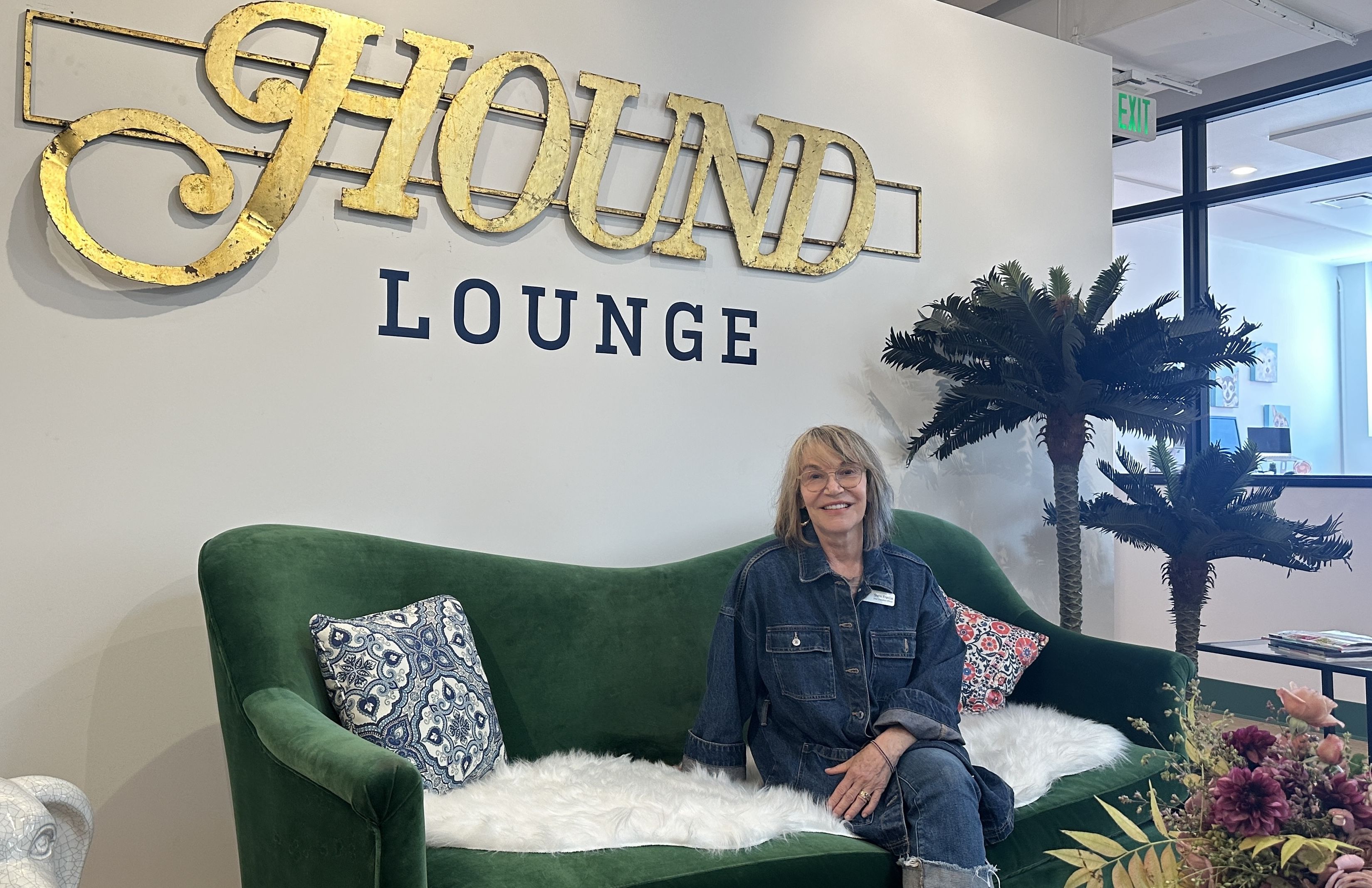 woman sitting on green couch