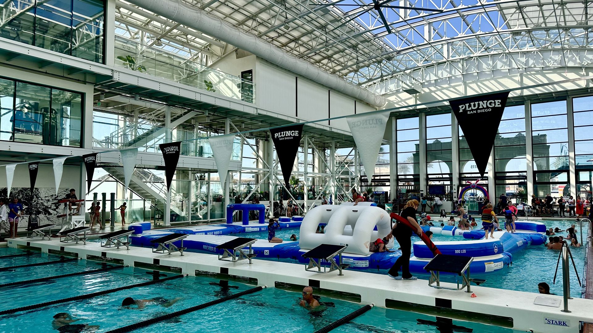two indoor swimming pools with a retractable roof