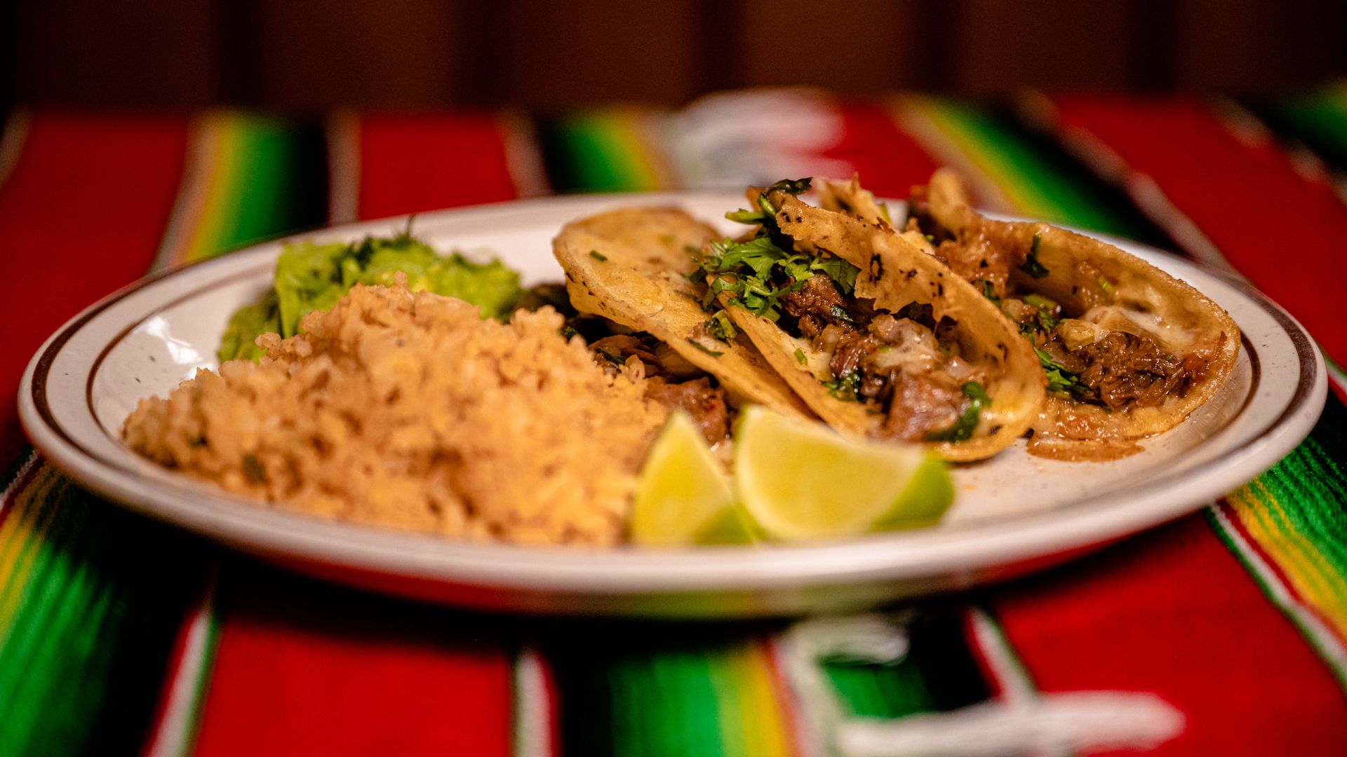 A plate filled with food sits on a table.