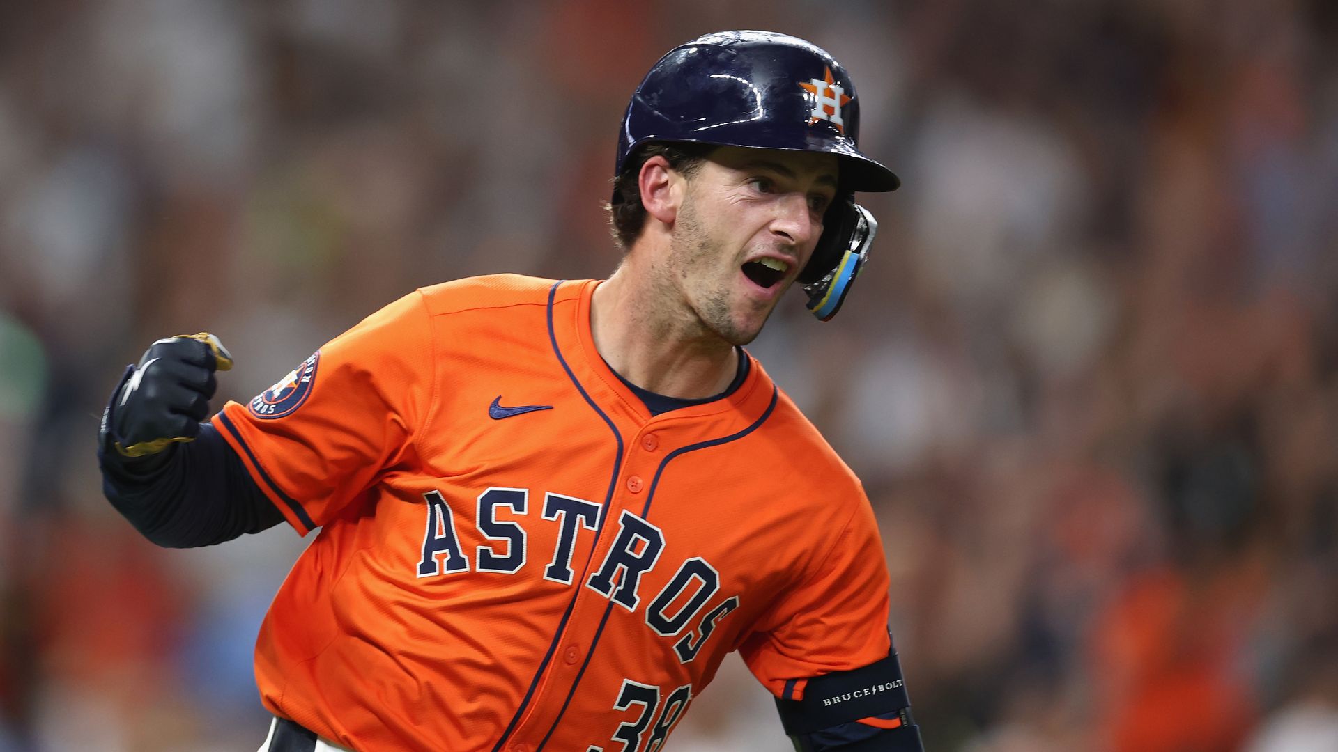 Zack Short #38 of the Houston Astros reacts after hitting a walk off RBI single in the eleventh inning against the Texas Rangers at Daikin Park