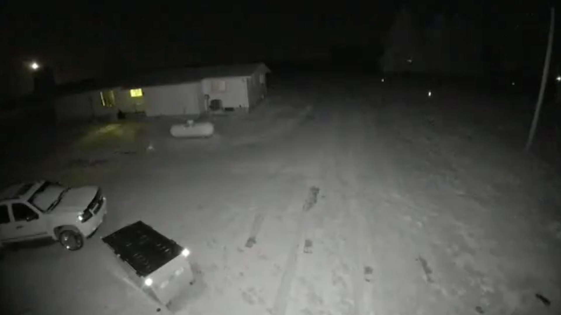 A surveillance camera showing a strange light up in the air