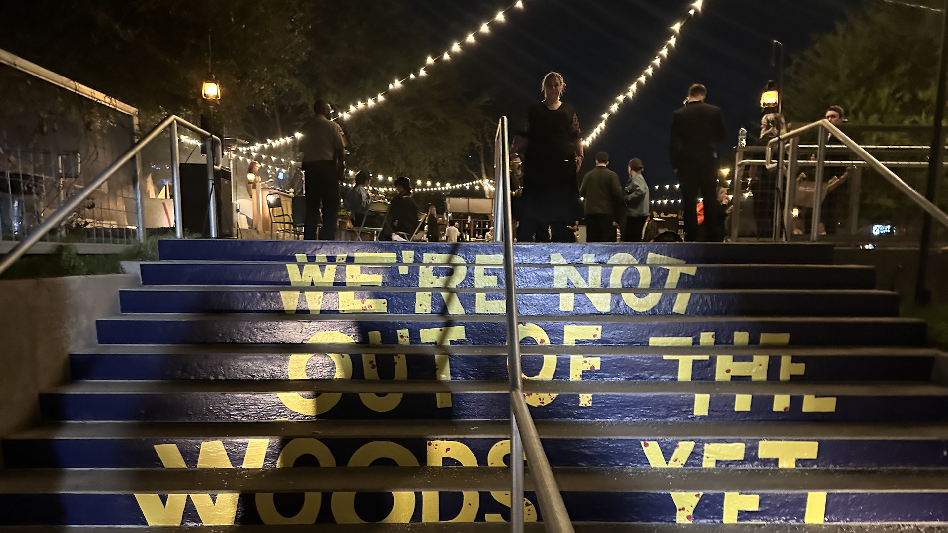 Showtime's Yellowjackets activation at SXSW had a staircase reading "We're Not Out Of The Woods Yet."
