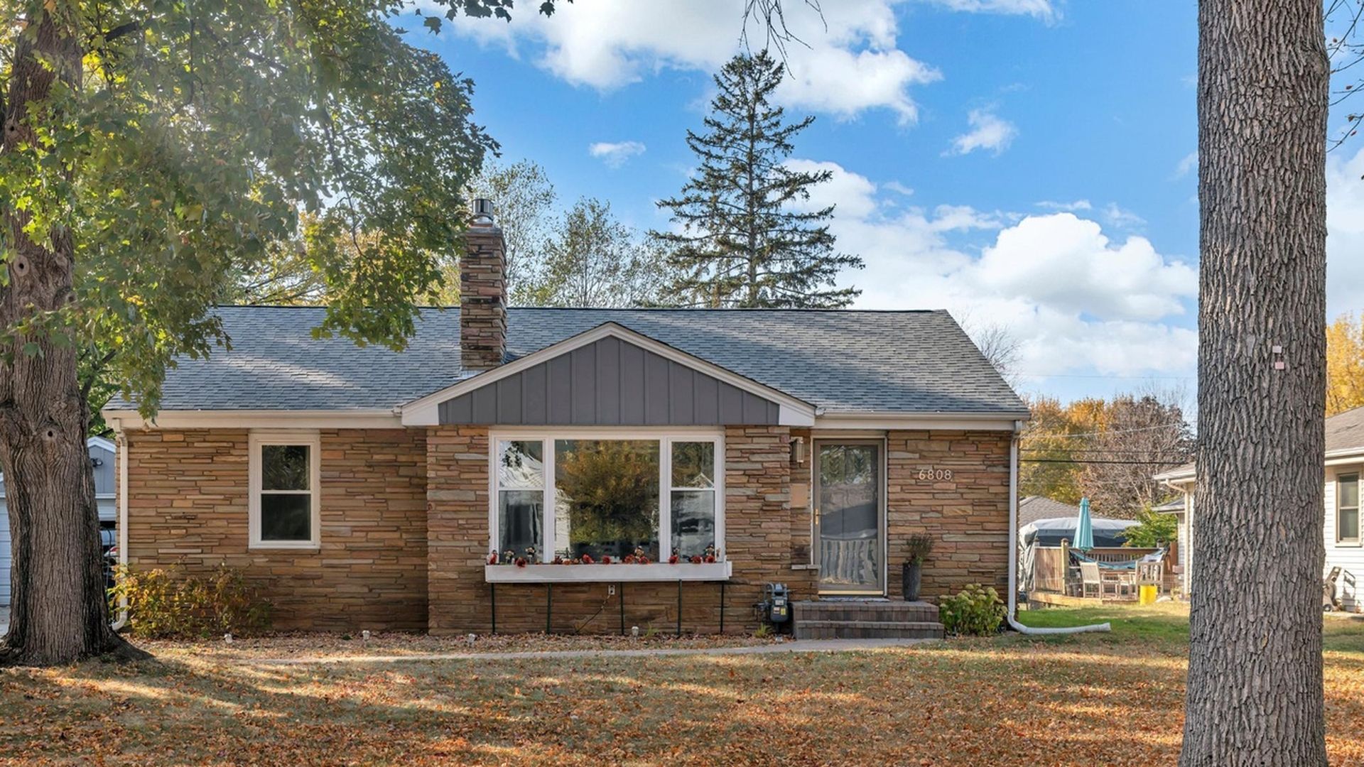 view of home with brick exterior