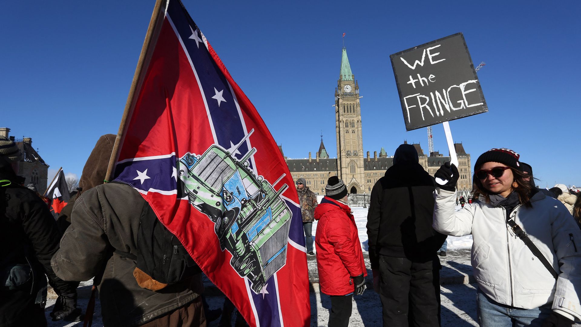 A supporter carries a US Confederate flag during the Freedom Convoy protesting Covid-19 vaccine mandates and restrictions in front of Parliament on January 29, 2022 in Ottawa, Canada.