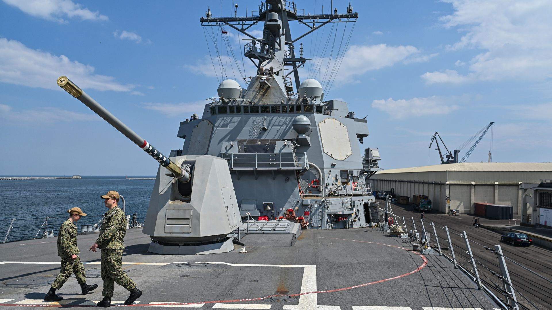 US navy soldiers walk on the deck of the USS Gravely Destroyer Ship moored at Gdynia Port on June 07, 2022 in Gdynia, Poland.