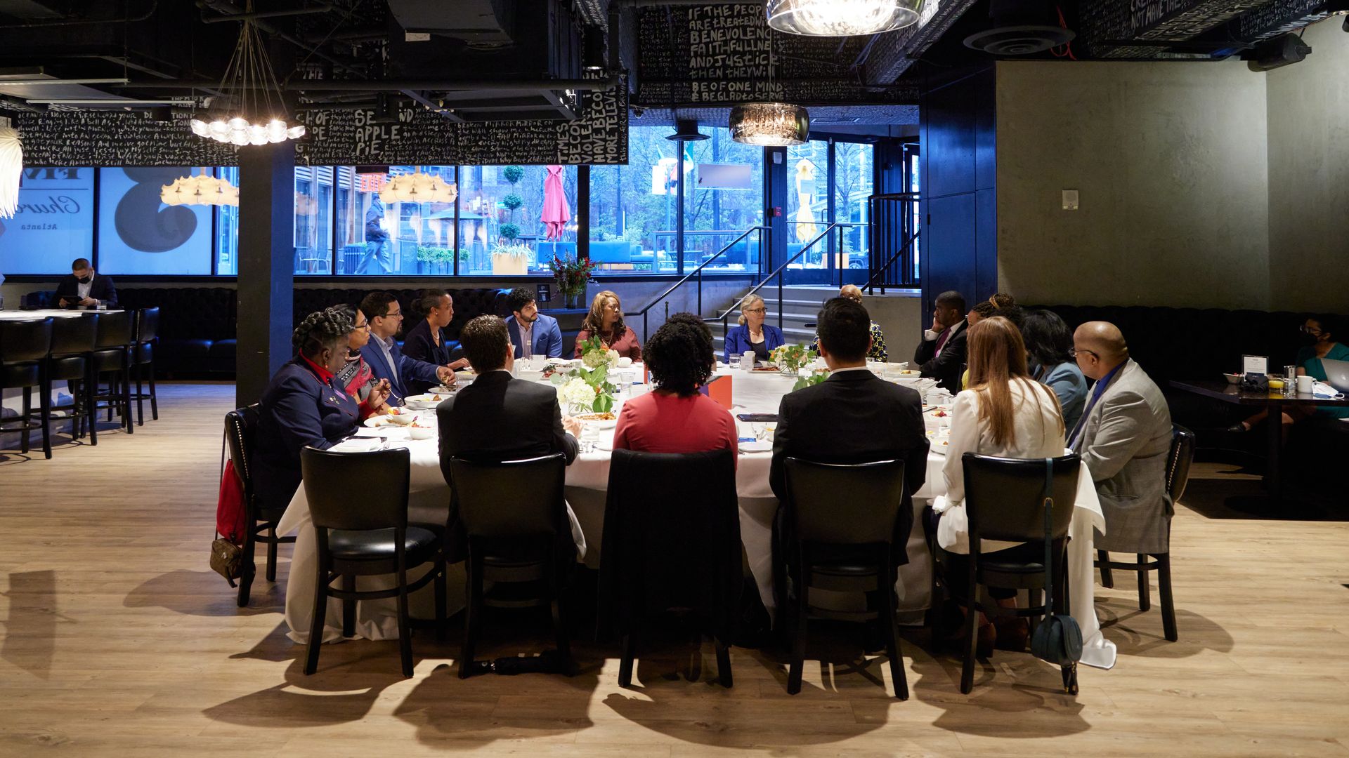 Participants enjoyed a seated breakfast during the discussion.