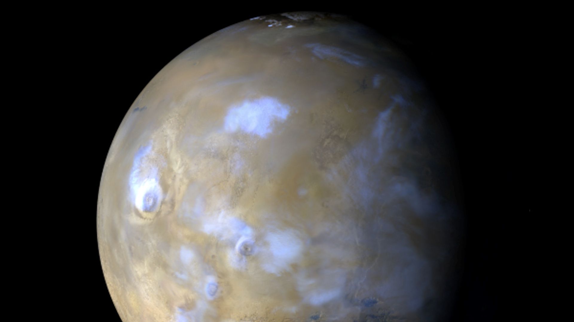 Clouds dotting Mars above its surface