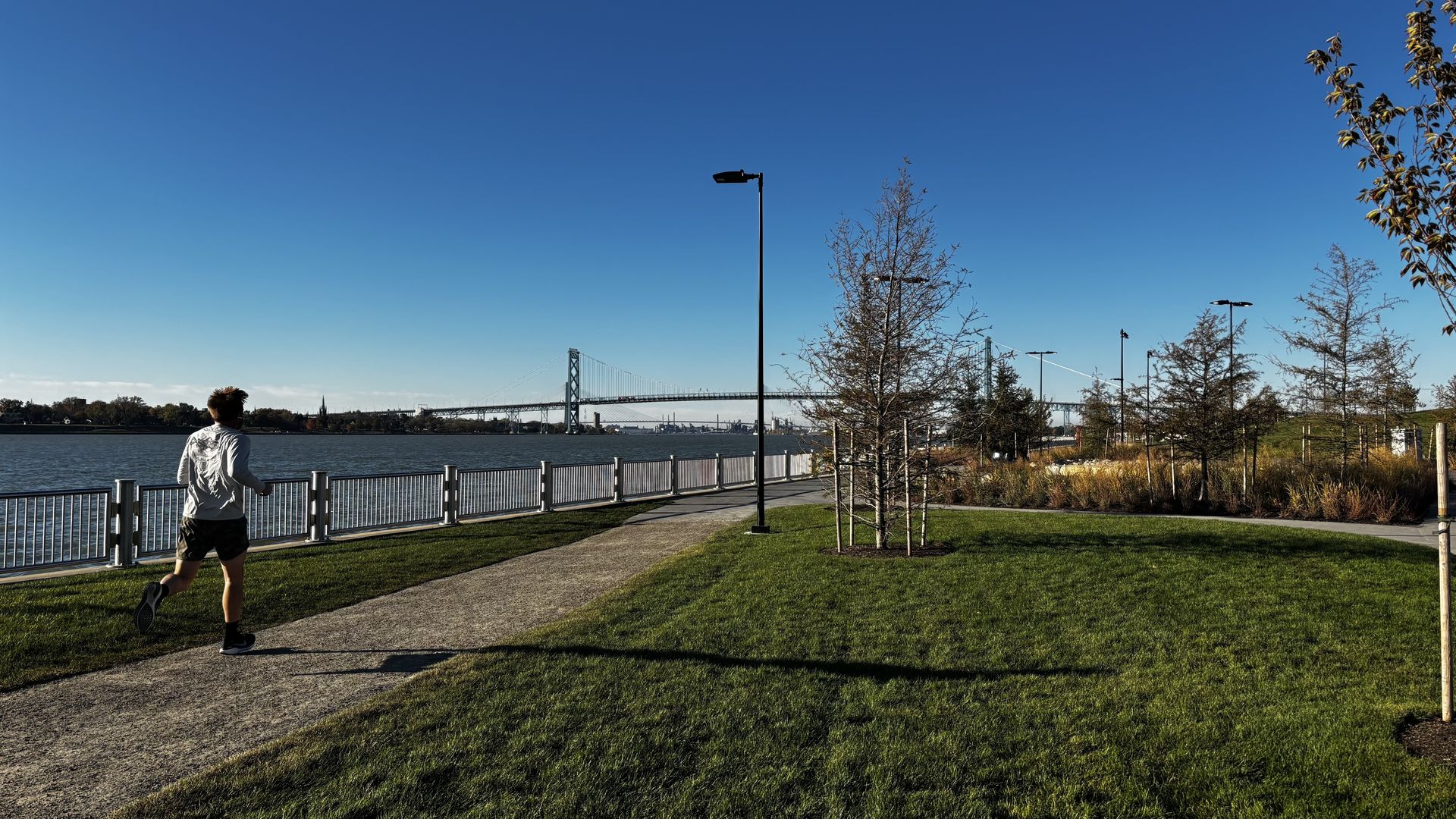 A jogger uses a trail at Detroit's new Ralph Wilson Park. 