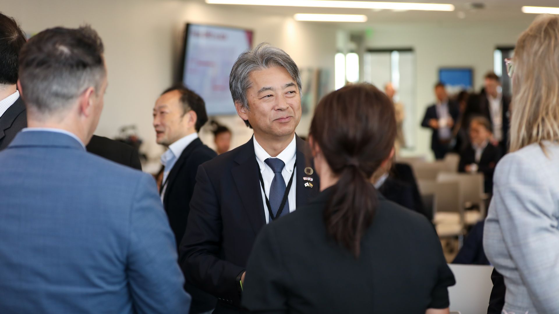 A man talking to a group of people.