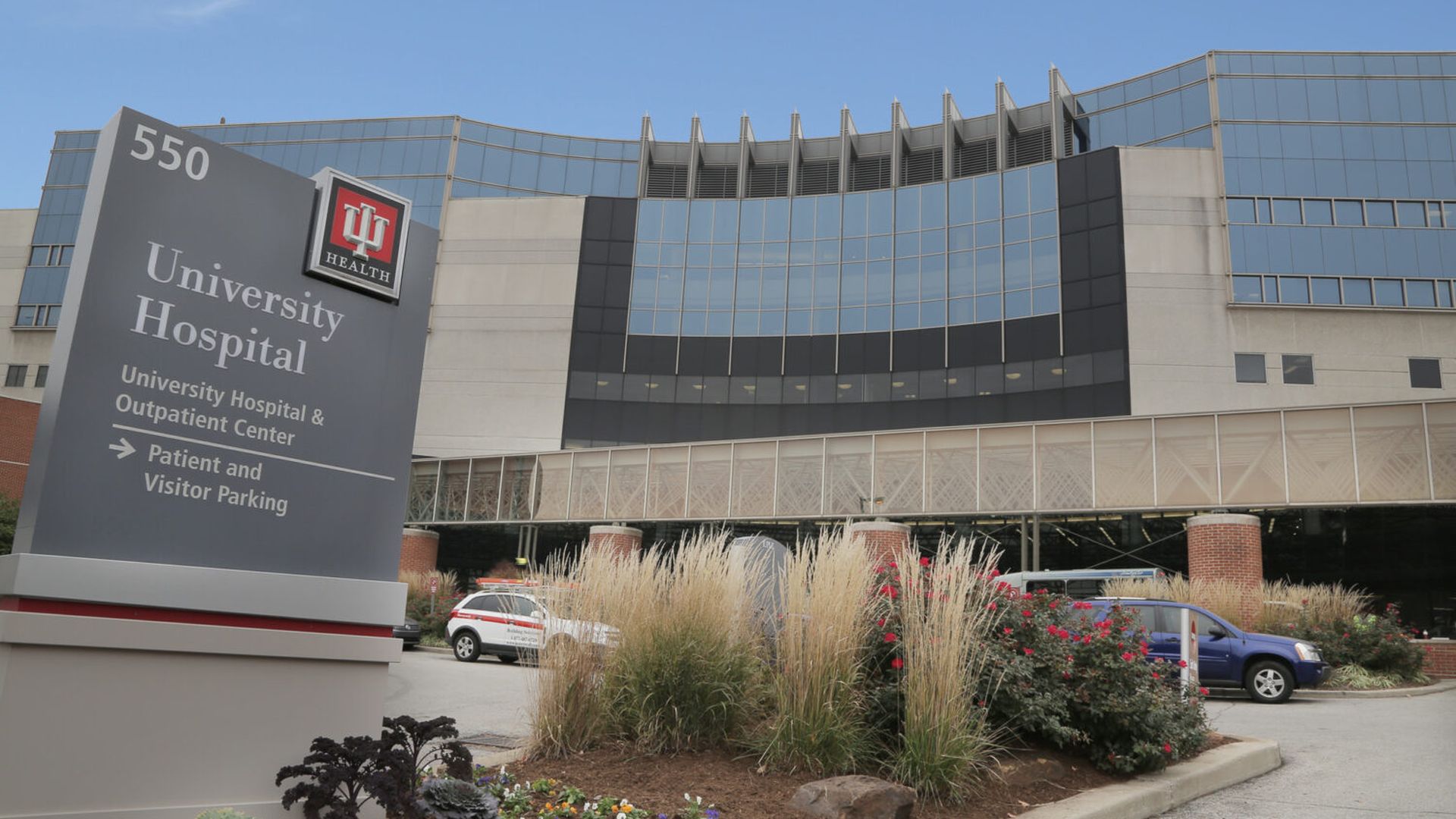 IU Health University Hospital building with a gray sign in front.