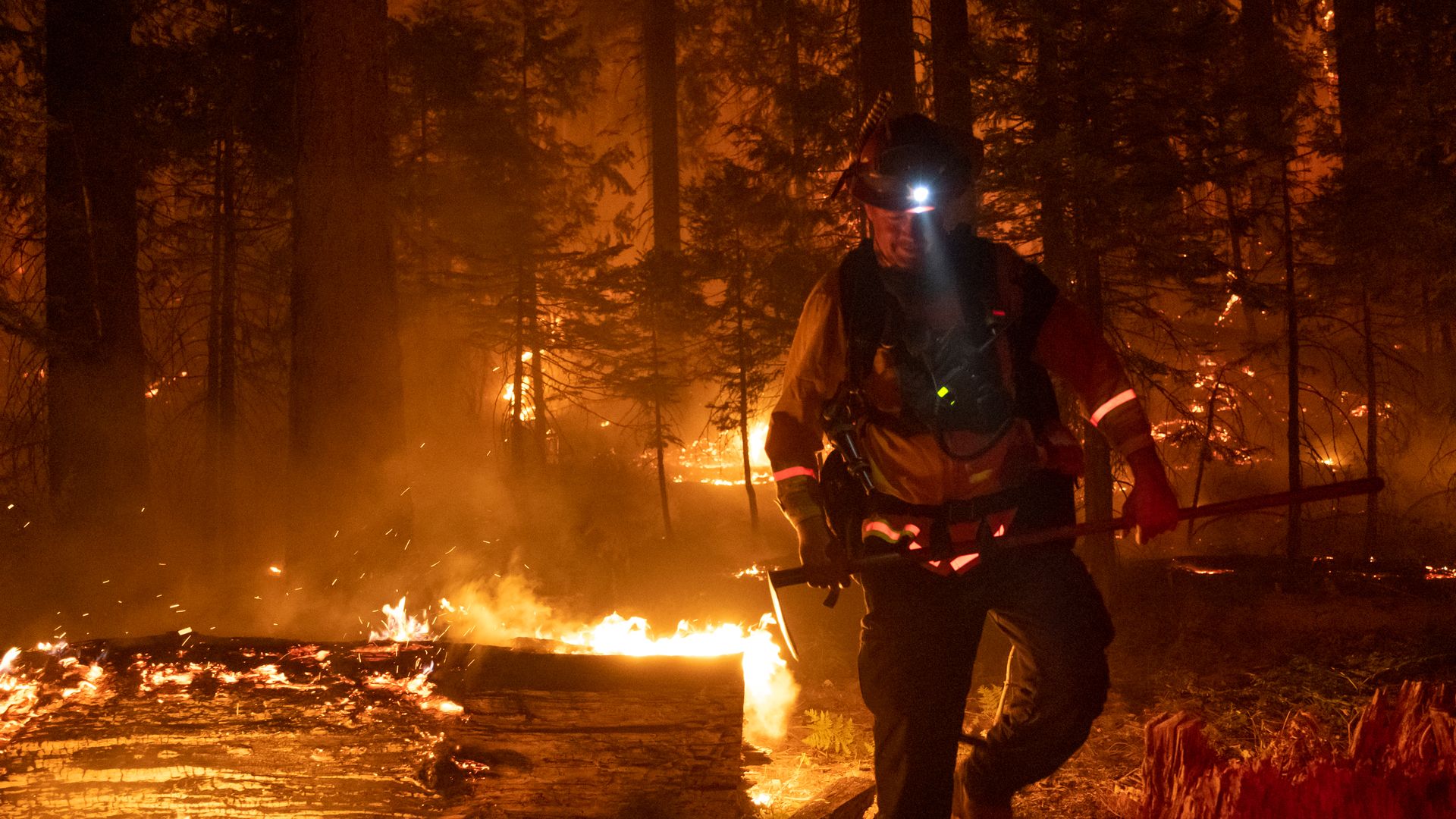 A firefighter battles flames 