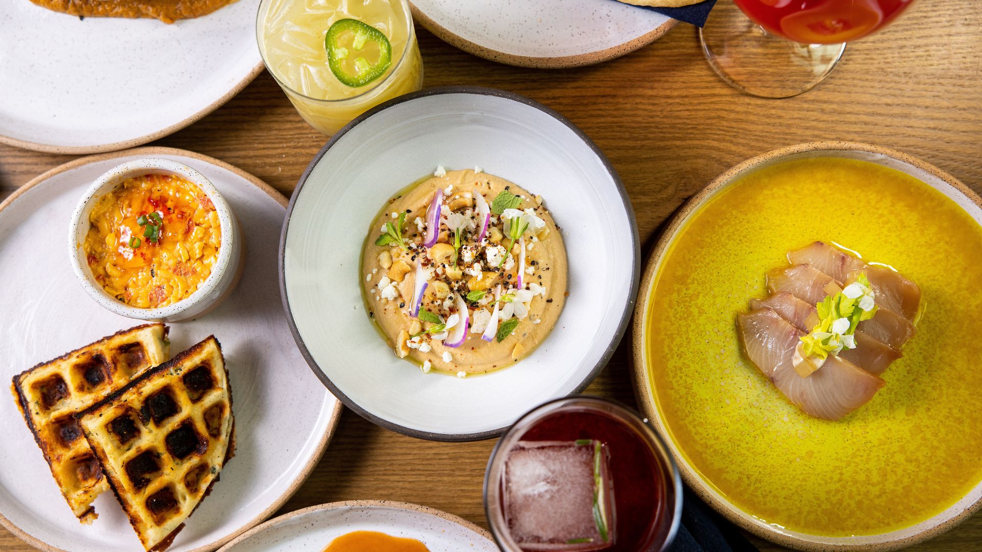Table with three plates of food on a table